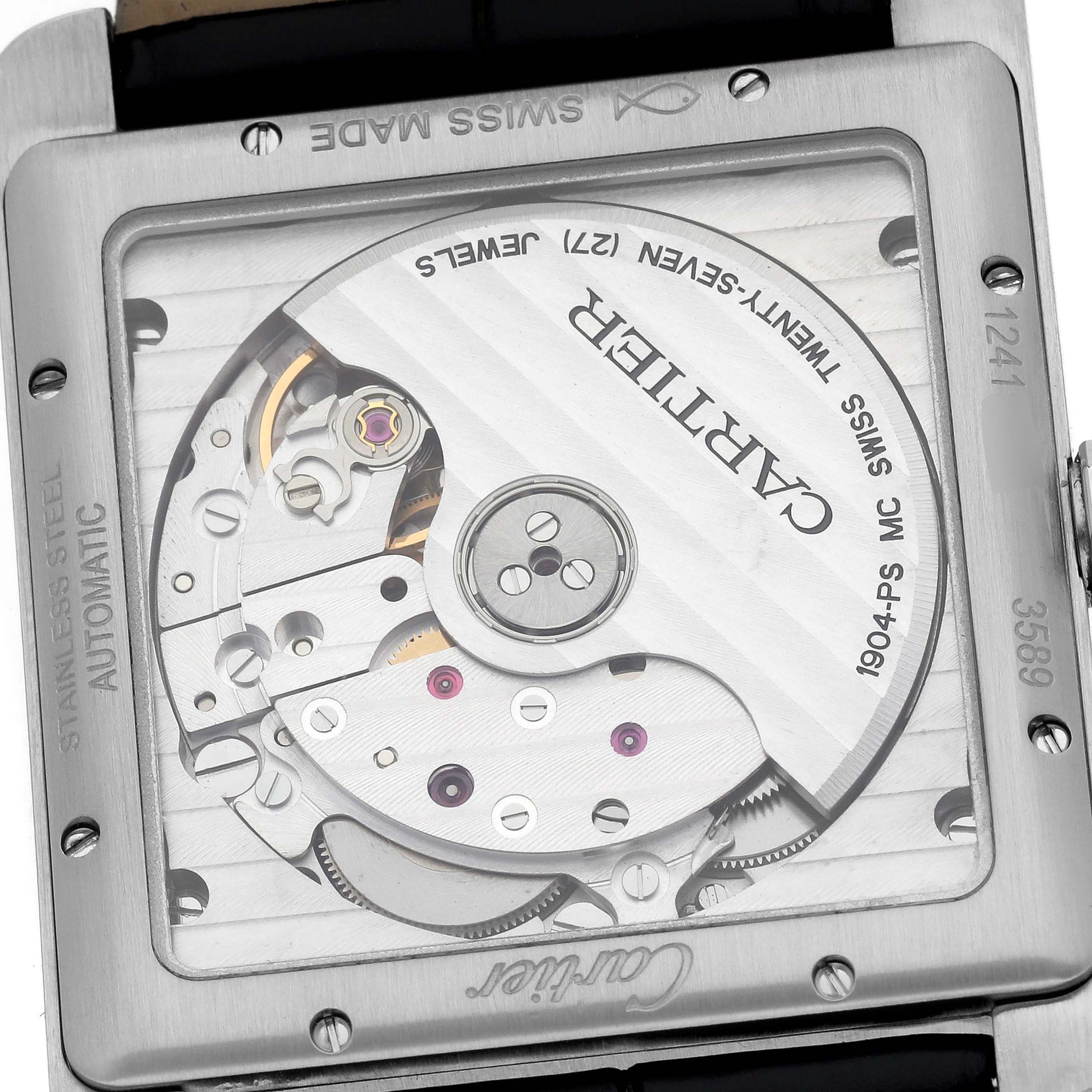 The image shows the back view of a Cartier Tank MC W5330004 Men's Stainless Steel Black Dial watch, highlighting its automatic movement and internal components.