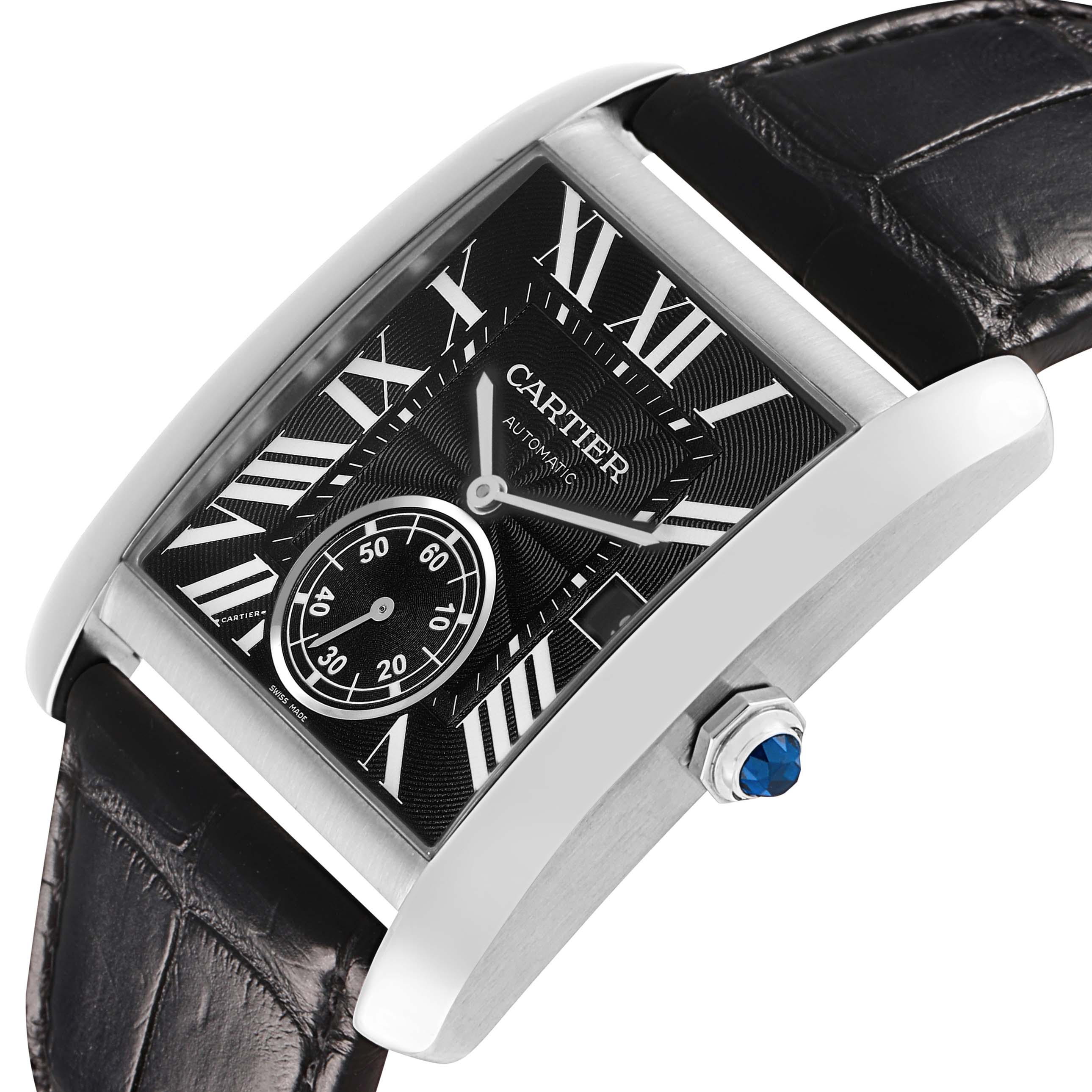 The Cartier Tank MC W5330004 Men's Stainless Steel Black Dial watch is shown at an angled side view, highlighting the black dial, Roman numerals, and blue cabochon crown.