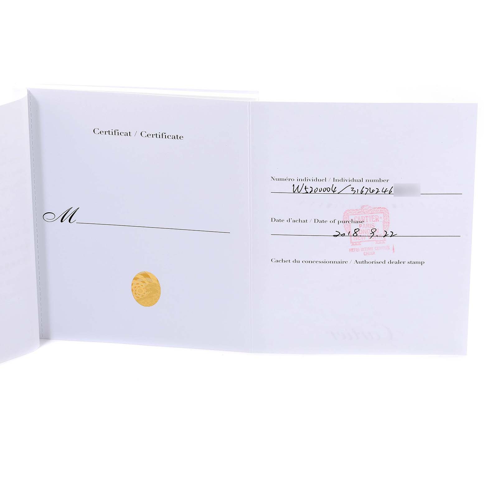 The image shows an open certificate for the Cartier Tank Solo W5200004 Men
s Steel and Gold (two tone) Silver Dial W5200004 Men
s Steel and Gold (two tone) Silver Dial watch model, featuring the individual number, date of purchase, and official stamp.