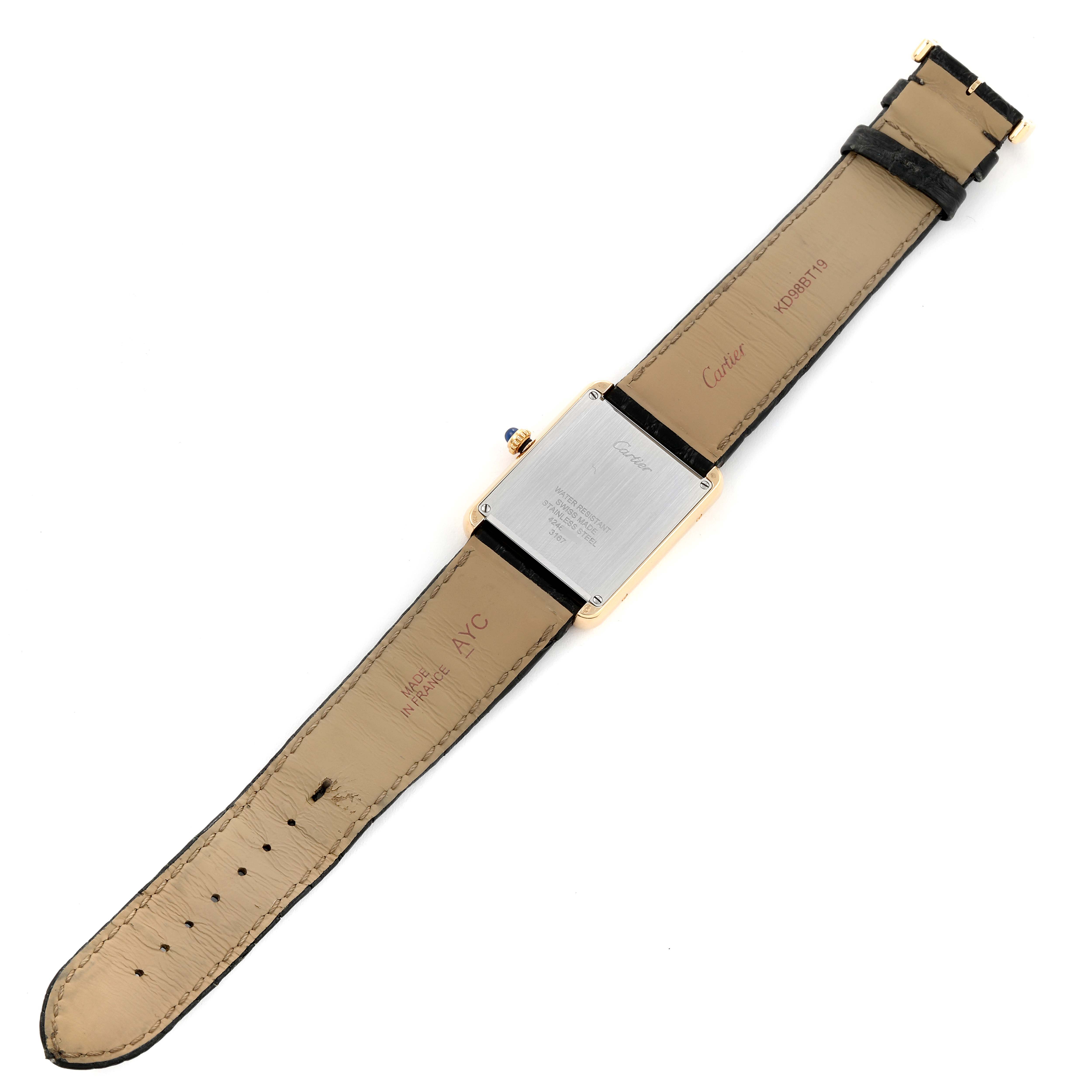 The Cartier Tank Solo W5200004 Men
s Steel and Gold (two tone) Silver Dial W5200004 Men
s Steel and Gold (two tone) Silver Dial watch is shown from the back, displaying its rectangular case and brown leather strap.