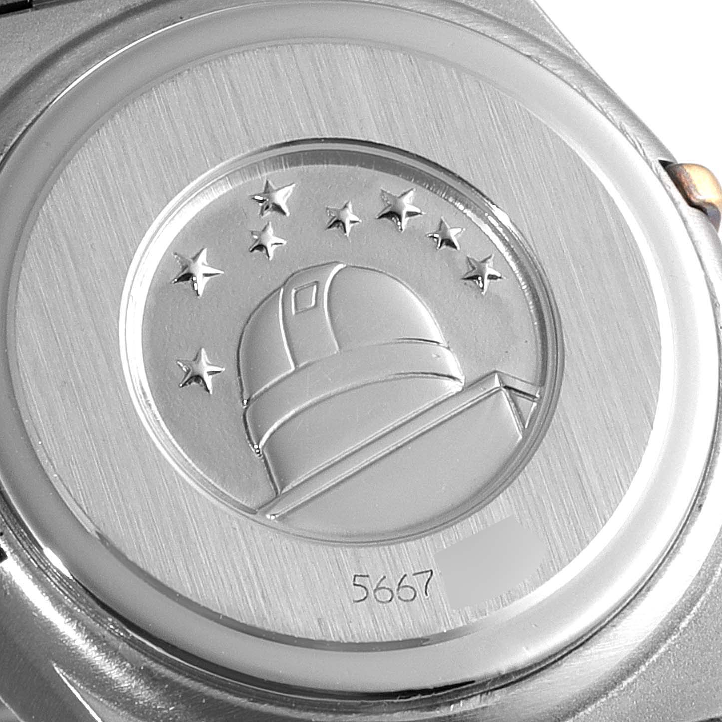 The image shows the case back of the Omega 1267.70.00 Women's Steel and Gold (two tone) Mother of Pearl Dial 1267.70.00 Women's Steel and Gold (two tone) Mother of Pearl Dial Constellation Steel Yellow Gold MOP Diamond Ladies Watch 1267.70.00.