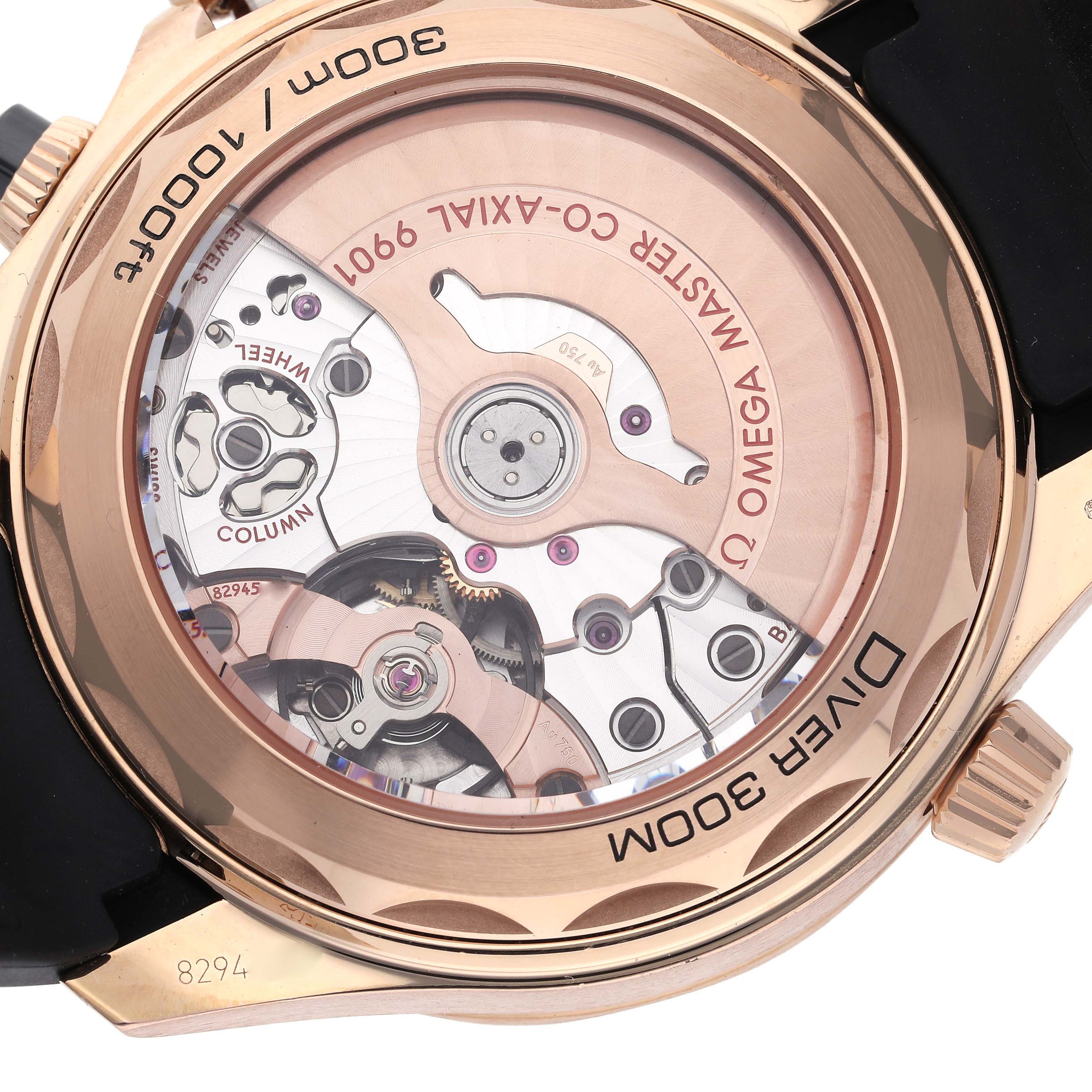 The image shows the back view of an Omega Seamaster 210.62.44.51.01.001 Men
s Rose Gold Black Dial 210.62.44.51.01.001 Men
s Rose Gold Black Dial dive watch, highlighting the movement and rotor.