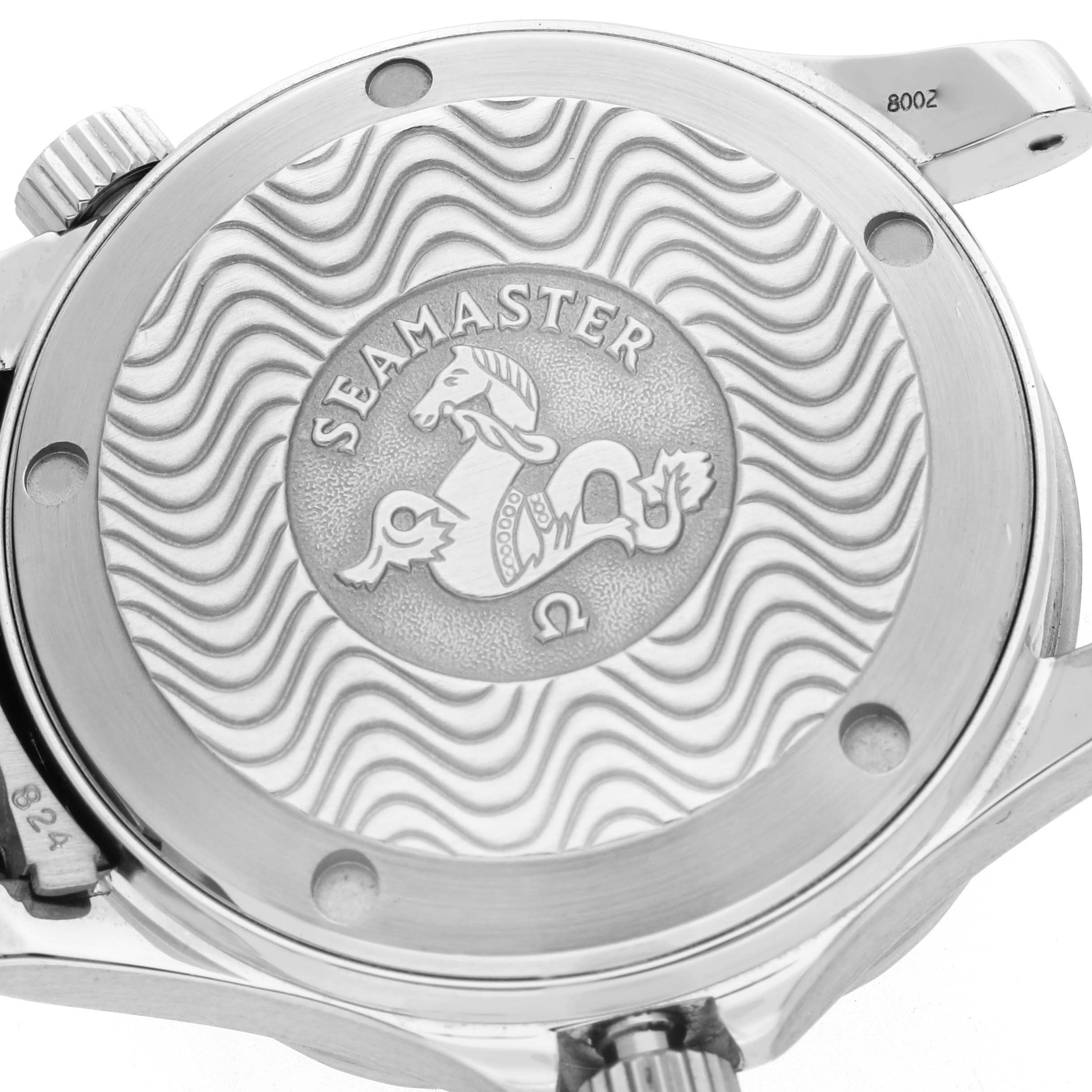 The image shows the back case of an Omega Seamaster 2551.80.00 Men's Stainless Steel Blue Dial watch, featuring an engraved wave pattern and logo.