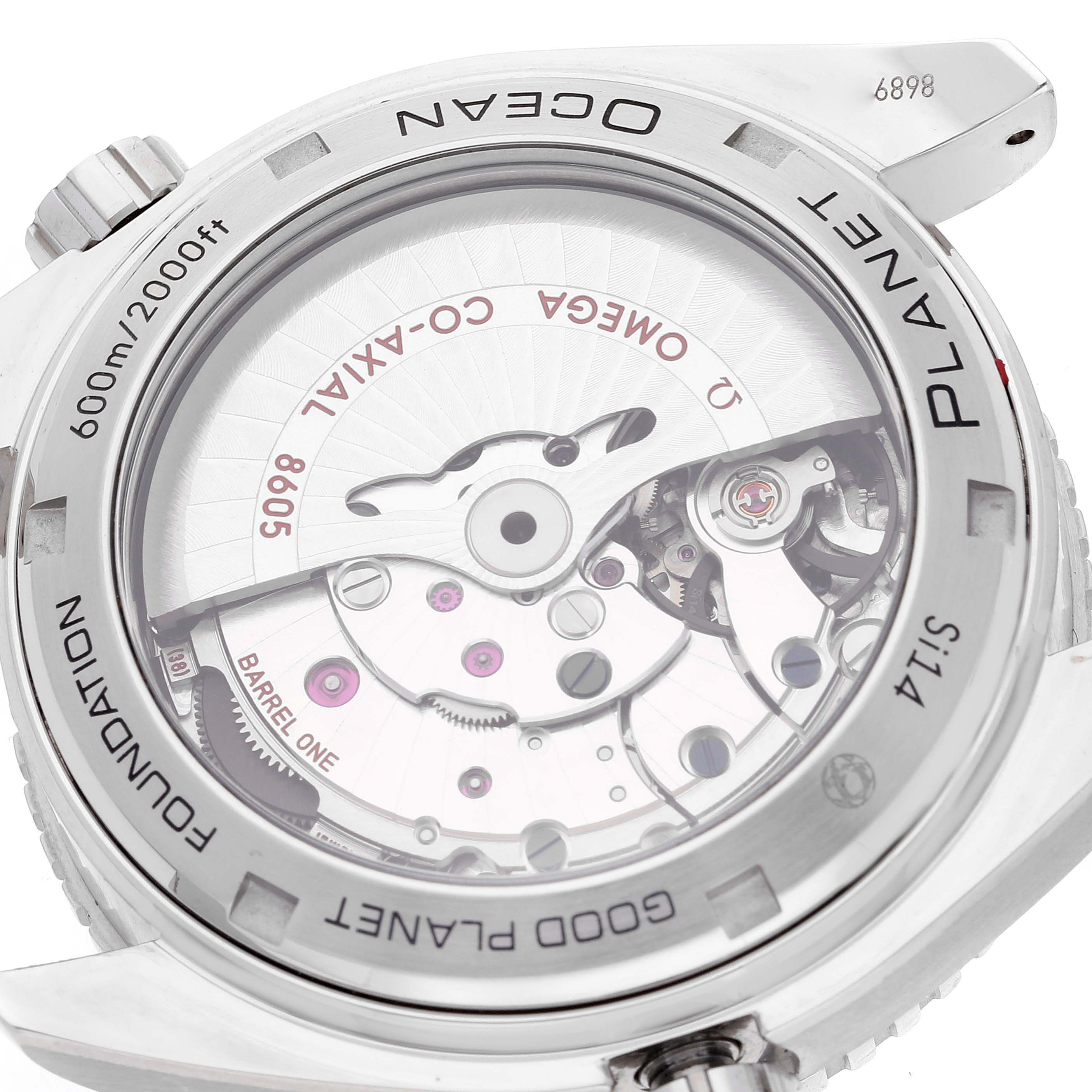 The image shows the case back of the Omega Planet Ocean 232.30.44.22.03.001 Men
s Stainless Steel Blue Dial 232.30.44.22.03.001 Men
s Stainless Steel Blue Dial watch, highlighting its movement and transparent case back.