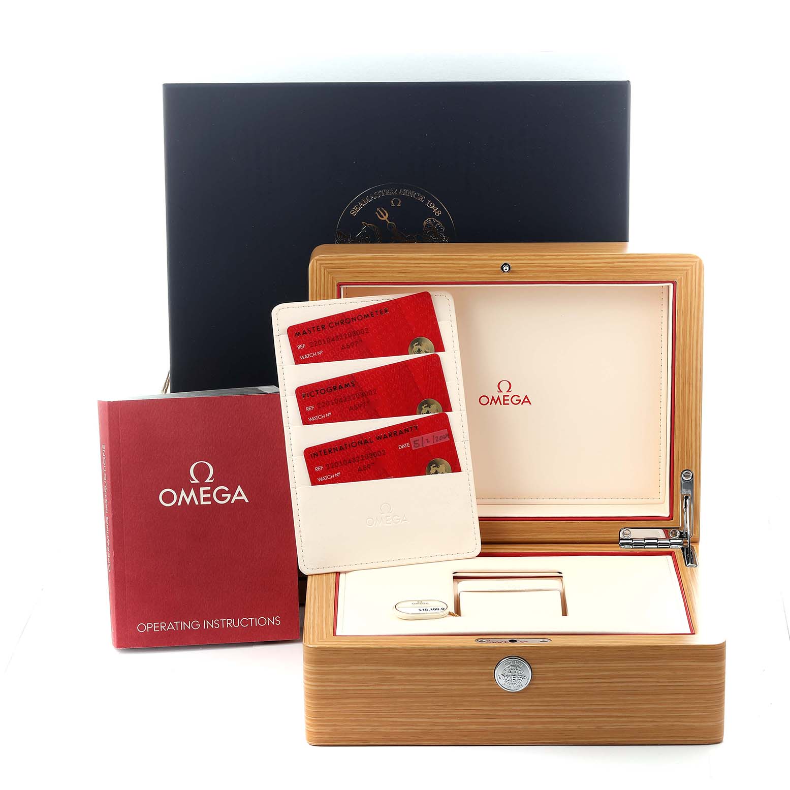 The image shows an Omega Seamaster 220.10.43.22.03.002 Men
s Stainless Steel Blue Dial 220.10.43.22.03.002 Men
s Stainless Steel Blue Dial box, with cards, a warranty case, and an operating manual.