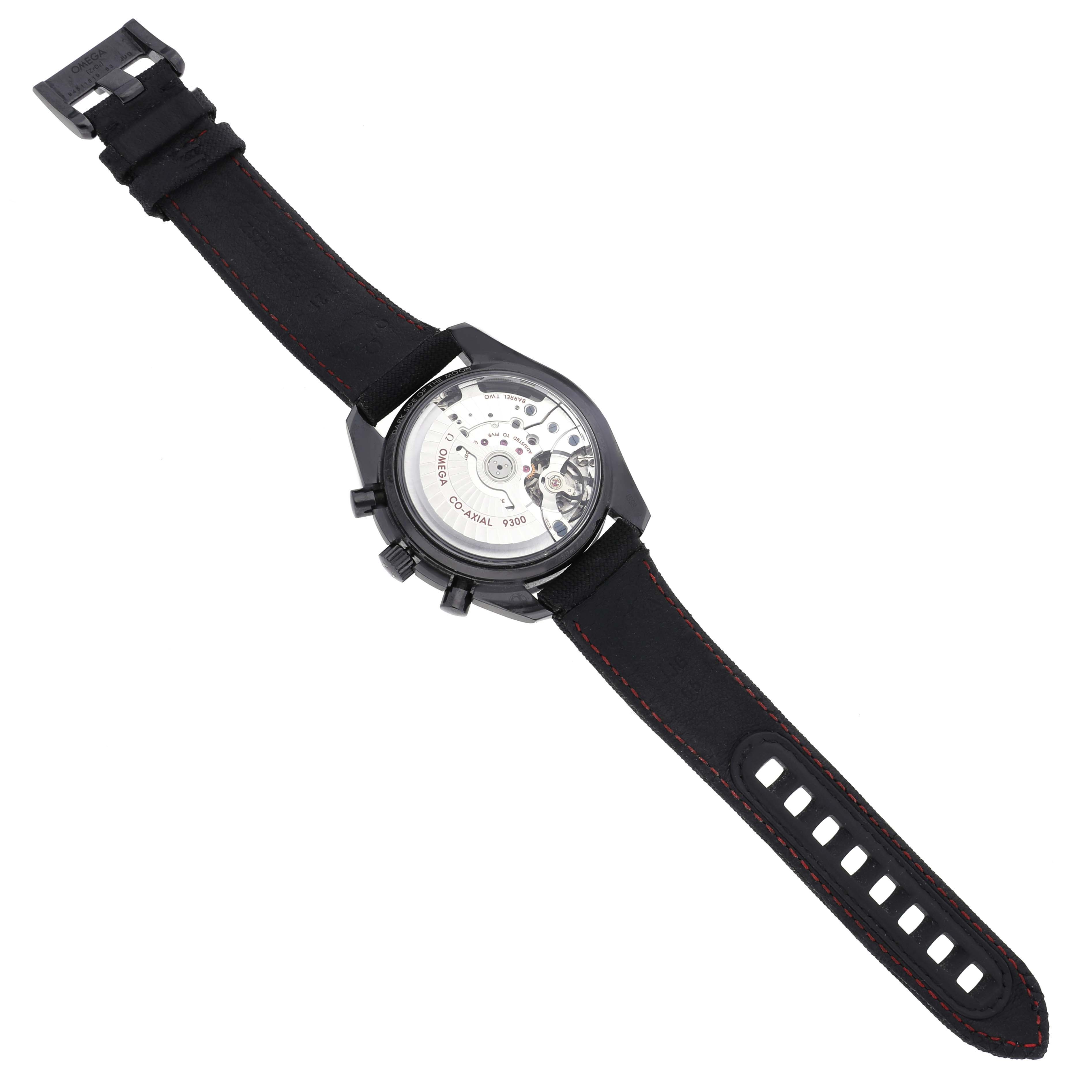 The Omega Speedmaster 311.92.44.51.01.003 Men's Ceramic Black Dial 311.92.44.51.01.003 Men's Ceramic Black Dial is shown from the back, displaying the movement and the black strap with clasp.