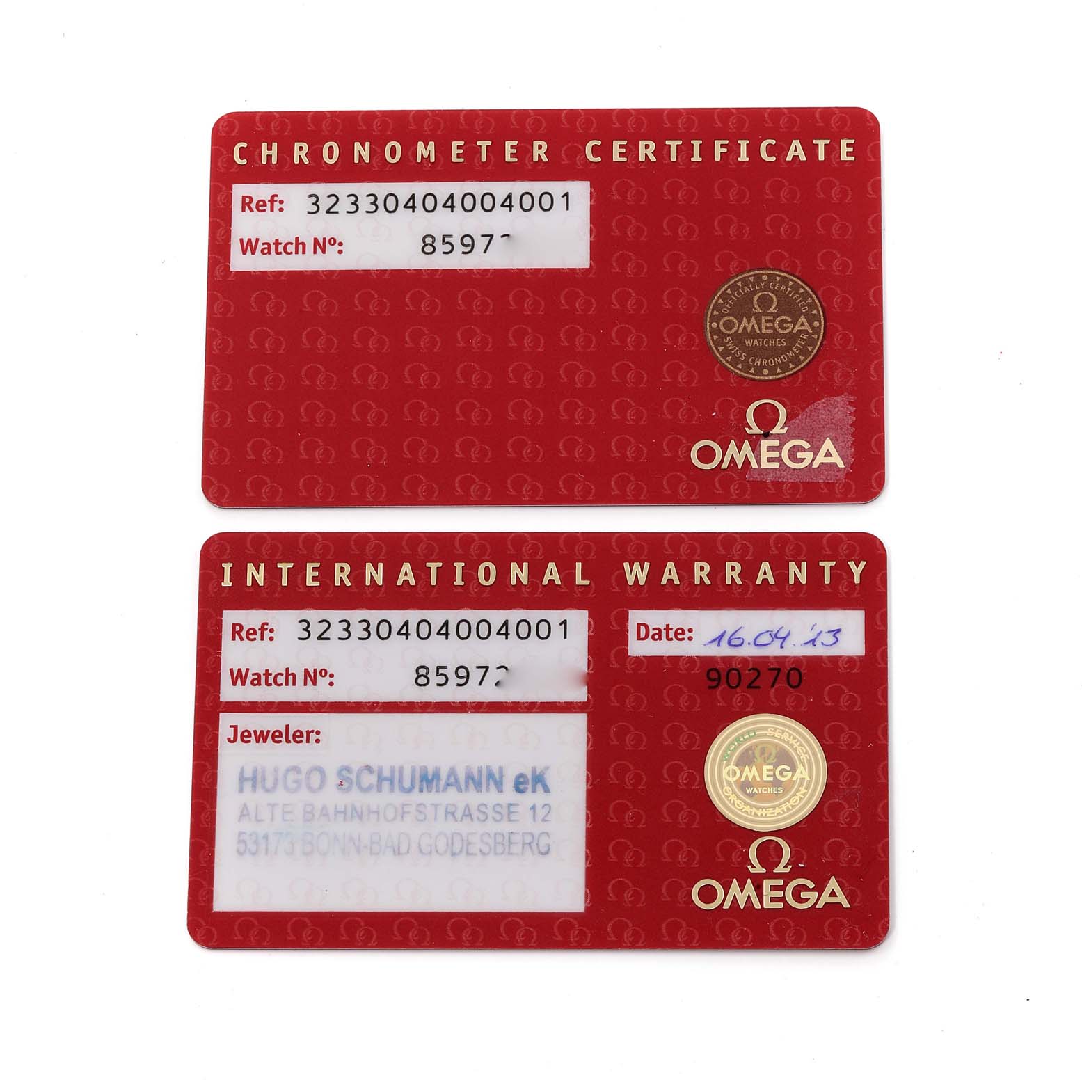 The image shows warranty and chronometer certificate cards for the Omega Speedmaster 323.30.40.40.04.001 Men
s Stainless Steel White Dial 323.30.40.40.04.001 Men
s Stainless Steel White Dial model.