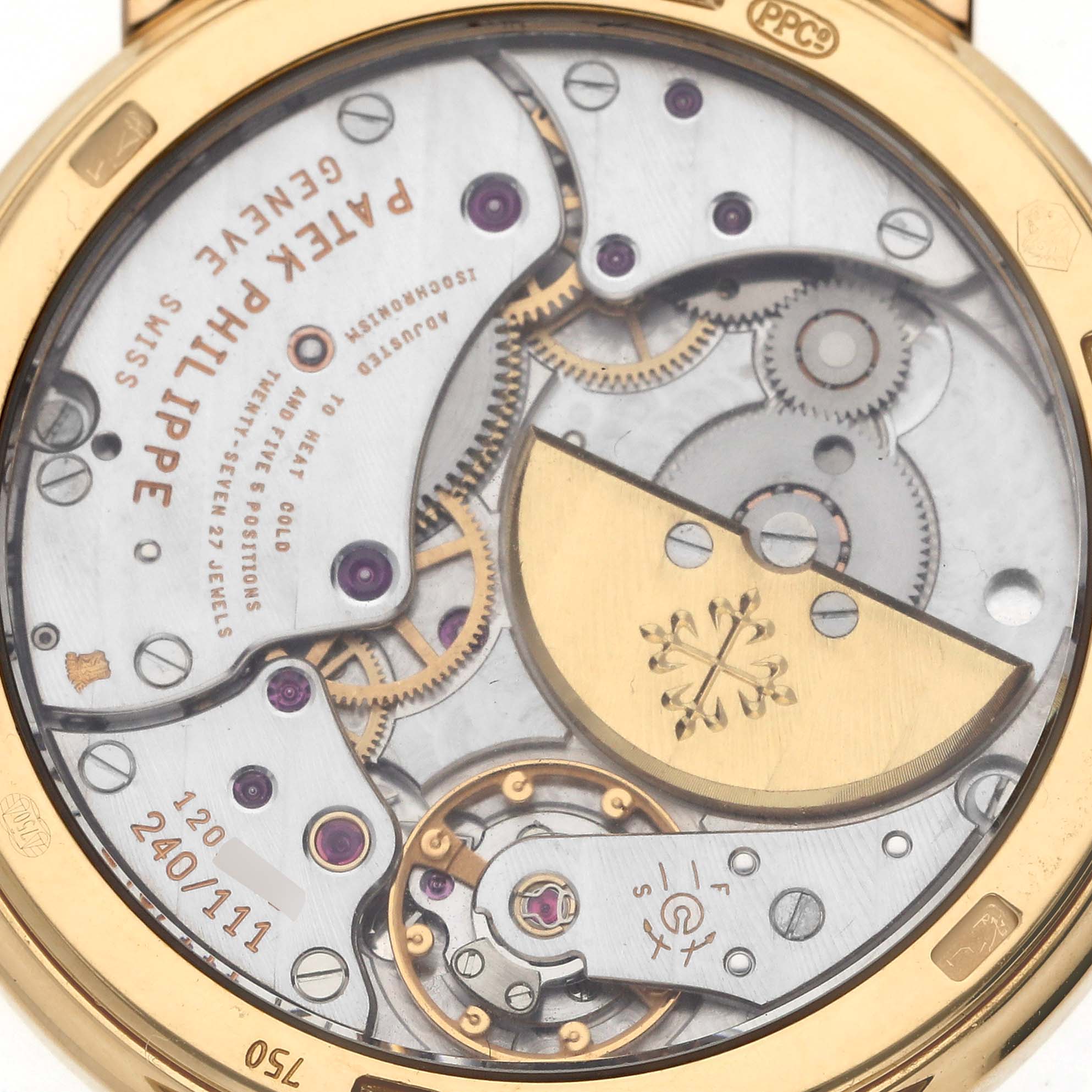 The image shows the case back of a Patek Philippe Calatrava 5120/1J-001 Men's Yellow Gold Silver Dial 5120/1J-001 Men's Yellow Gold Silver Dial, highlighting the intricate movement and rotor.