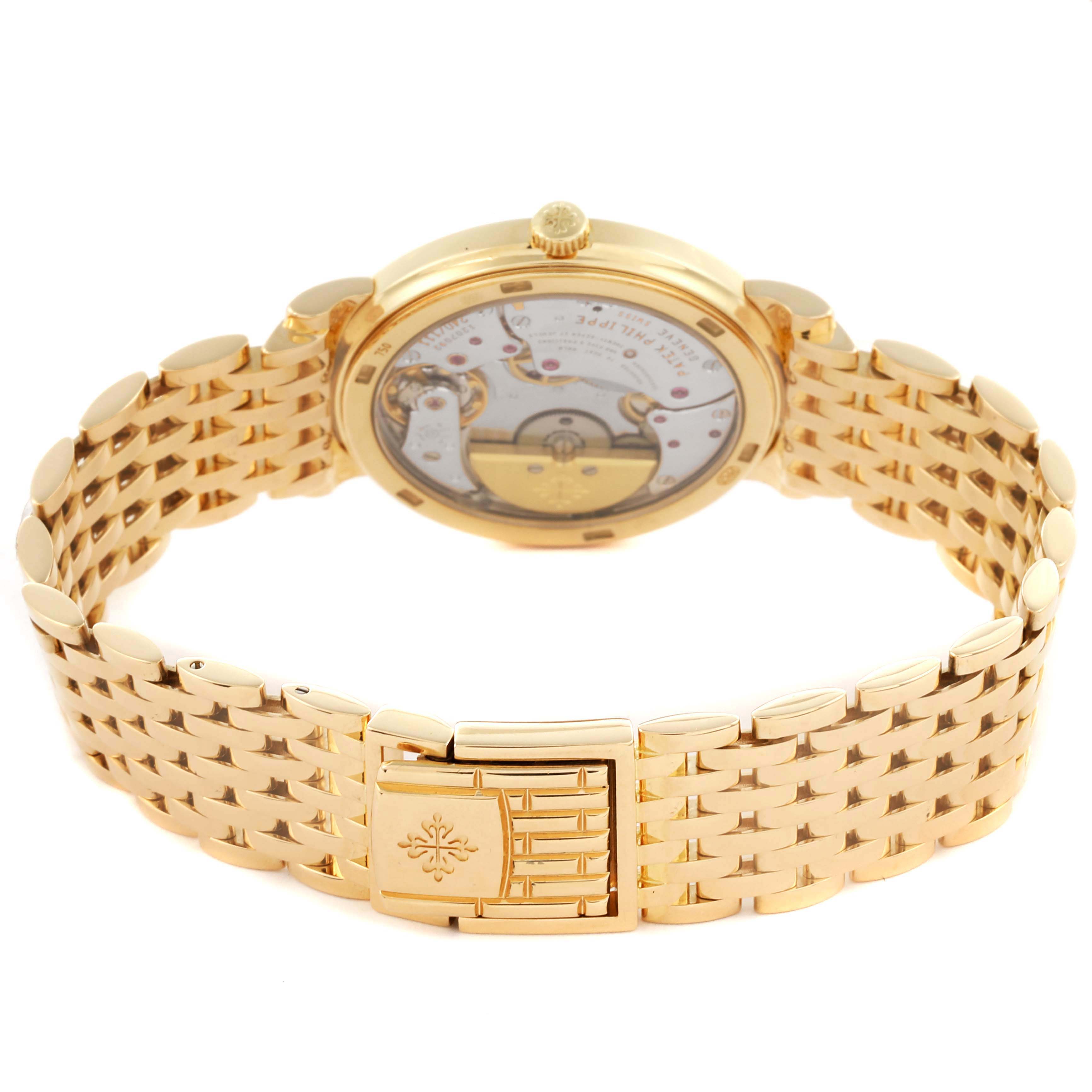 The Patek Philippe Calatrava 5120/1J-001 Men's Yellow Gold Silver Dial 5120/1J-001 Men's Yellow Gold Silver Dial watch is shown from the back, highlighting the movement and gold bracelet clasp.