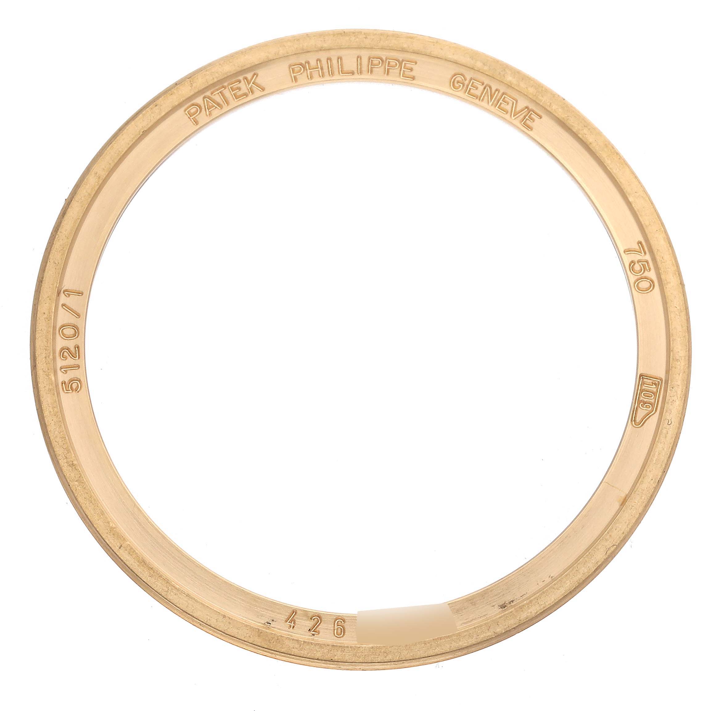 This is a close-up of a Patek Philippe Calatrava 5120/1J-001 Men's Yellow Gold Silver Dial 5120/1J-001 Men's Yellow Gold Silver Dial bezel with engravings and model details visible.