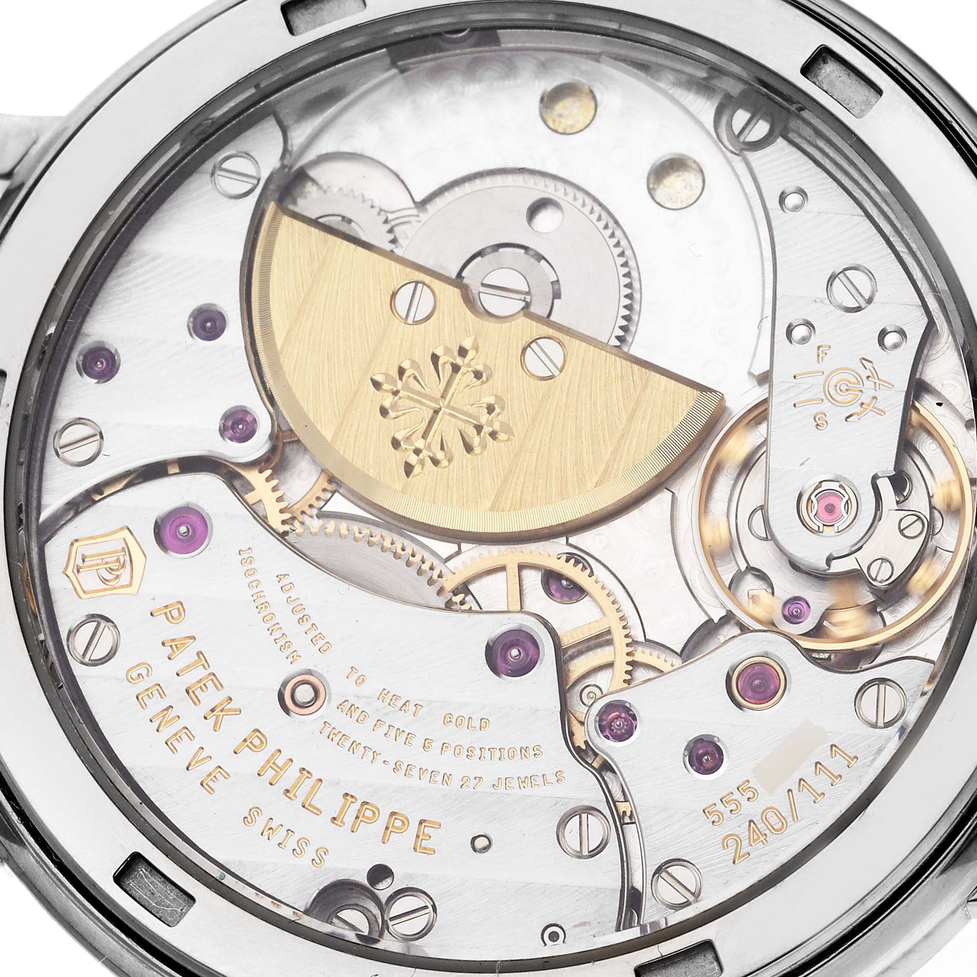 The image shows the movement of a Patek Philippe Calatrava 5120G Men's White Gold White Dial 5120G Men's White Gold White Dial watch from a back view, highlighting gears and engravings.