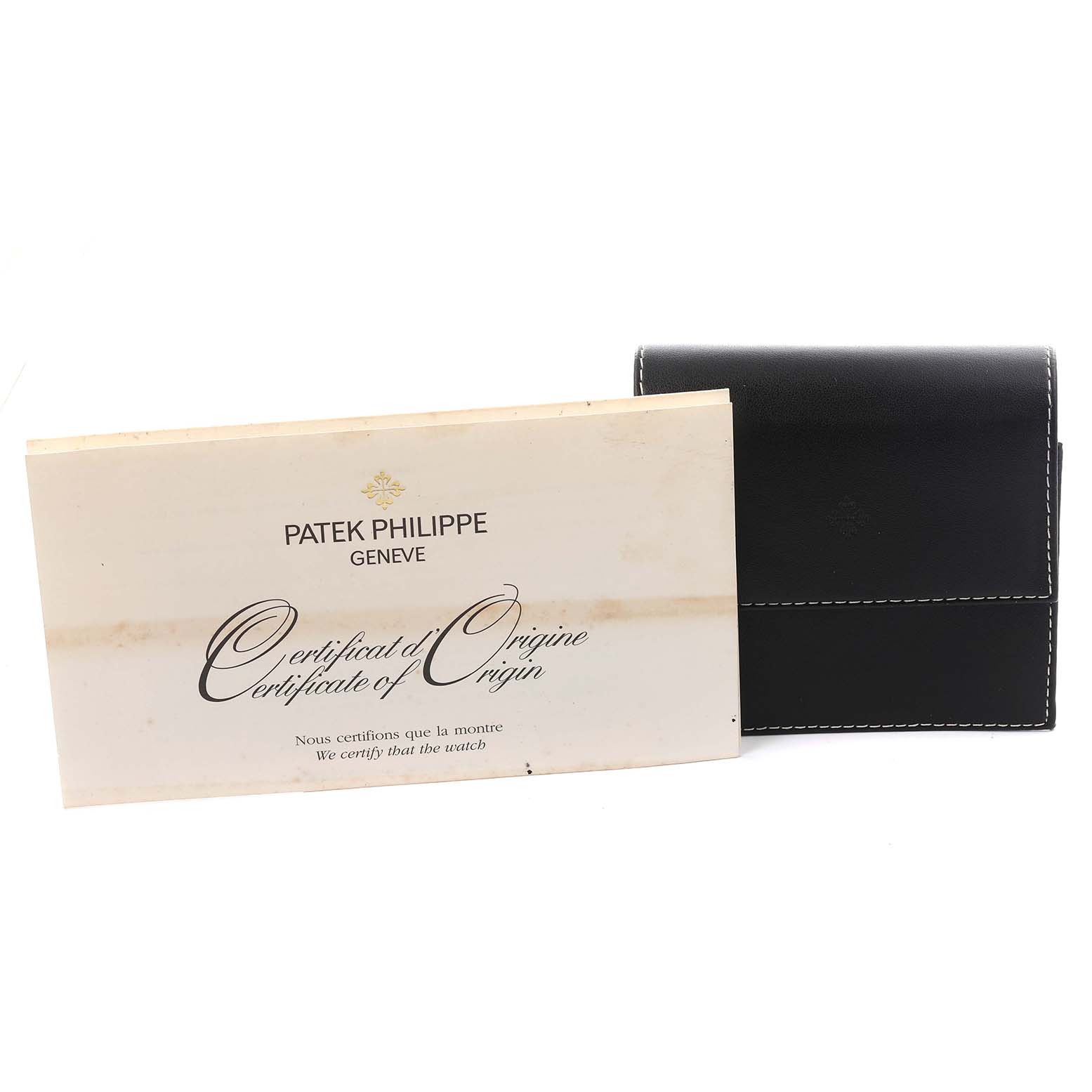 The image shows a Patek Philippe Calatrava 5120G Men's White Gold White Dial 5120G Men's White Gold White Dial certificate and a black case angled slightly from the front.