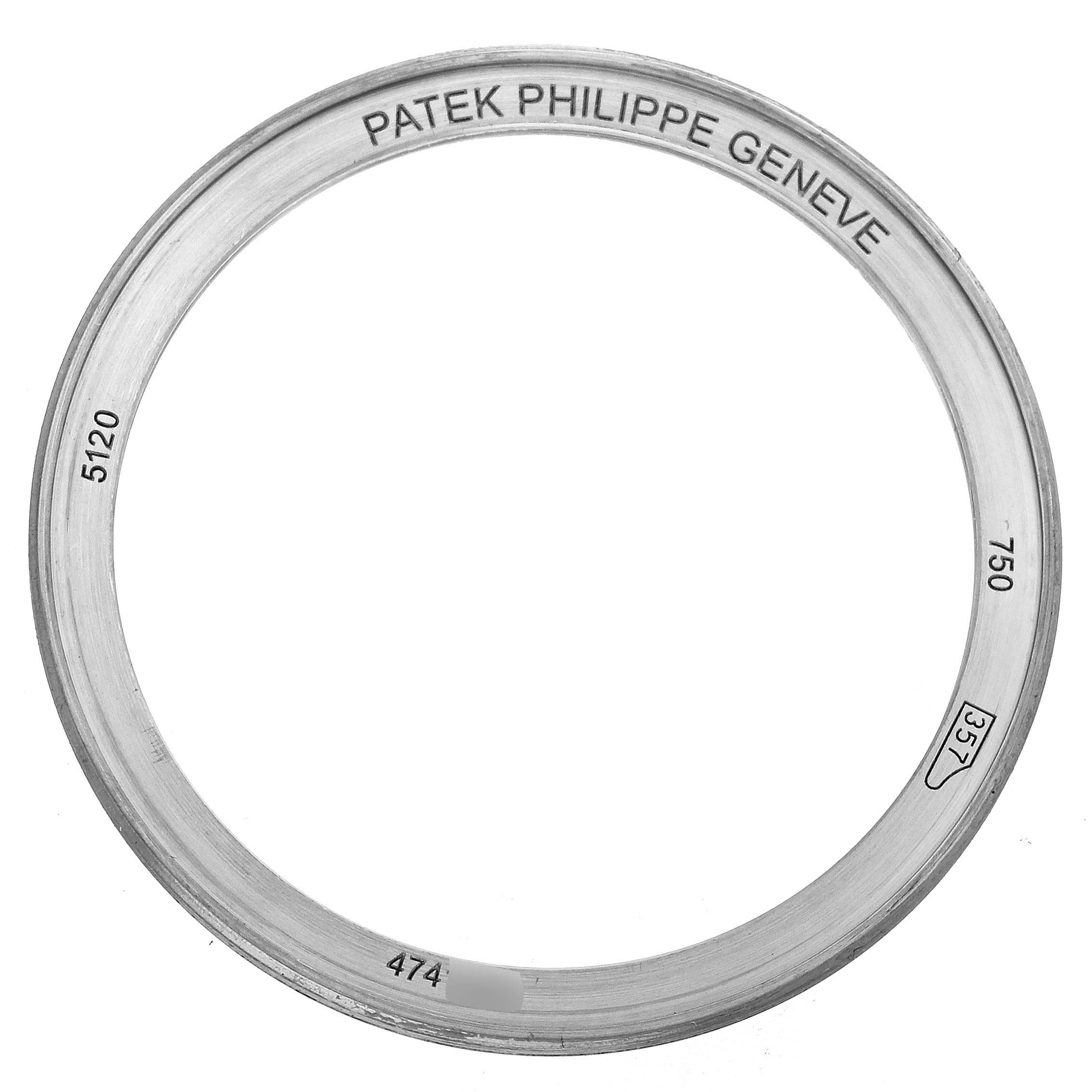 This image shows a front view of a Patek Philippe Calatrava 5120G Men's White Gold White Dial 5120G Men's White Gold White Dial model bezel with engraved markings.
