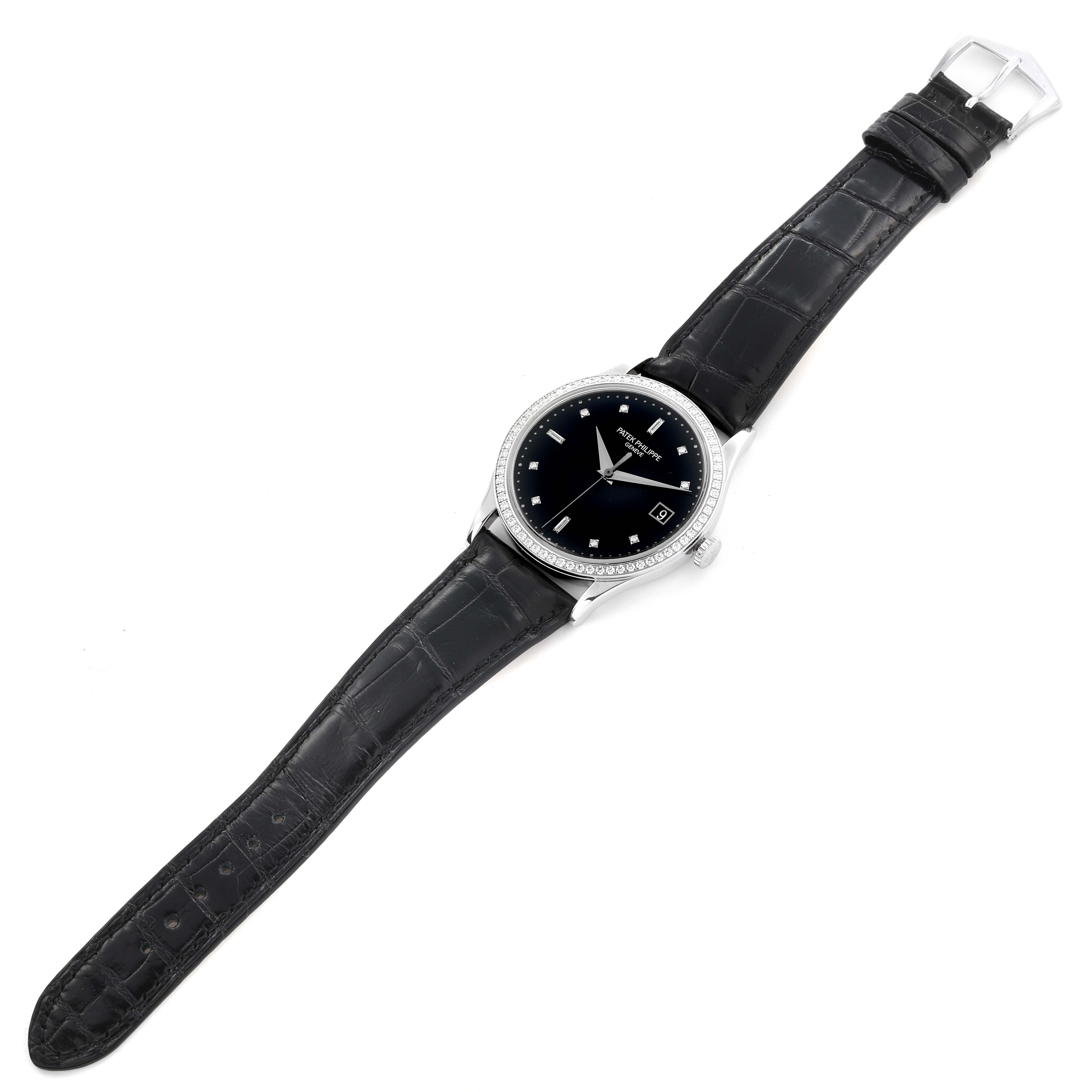 The Patek Philippe Calatrava 5297G-001 Men's White Gold Black Dial 5297G-001 Men's White Gold Black Dial watch is shown from a top-down angle, displaying its face, bezel, strap, and buckle.