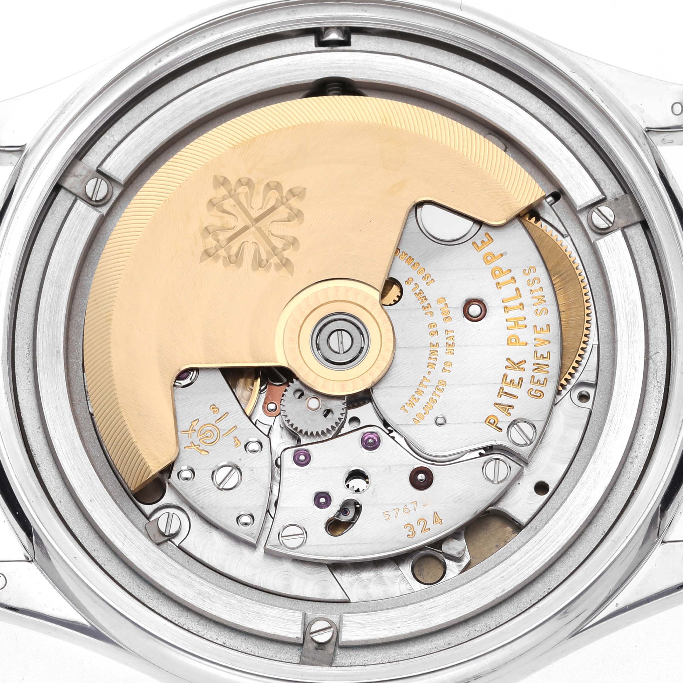 The image shows the back view of a Patek Philippe Calatrava 5297G-001 Men's White Gold Black Dial 5297G-001 Men's White Gold Black Dial watch, highlighting its mechanical movement and rotor.