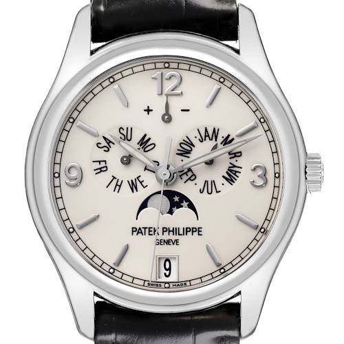 The Patek Philippe Calatrava watch is shown from a front angle displaying its dial, hands, and calendar features.