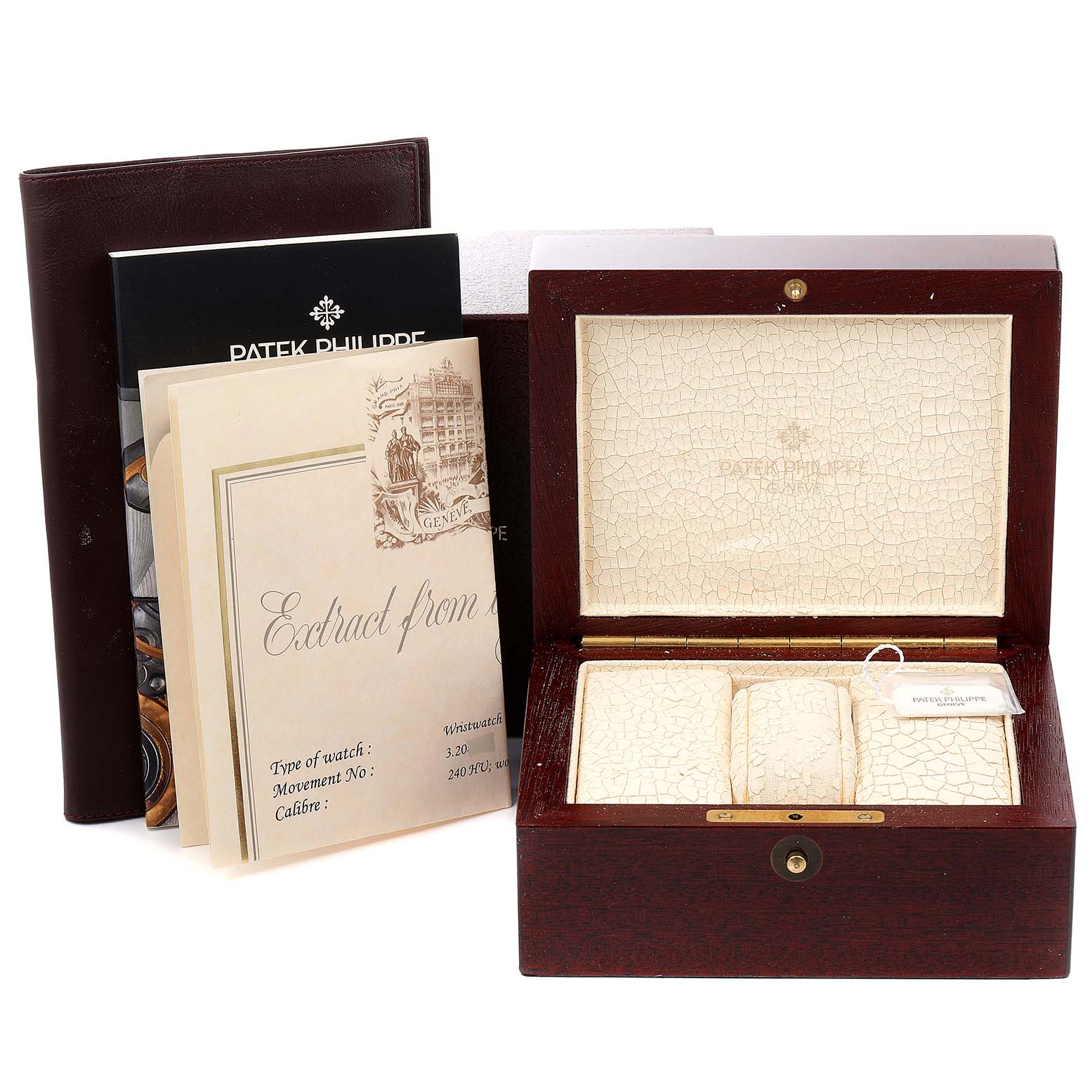 The image shows an open Patek Philippe Complications 5110P Men
s Platinum Silver Dial 5110P Men
s Platinum Silver Dial watch box with the manual and certification displayed around it.