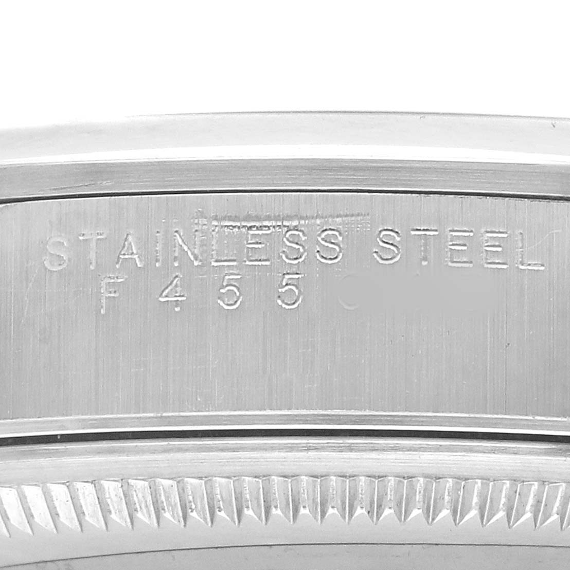 The image shows a close-up of the stainless steel band of a Rolex Air-King 14000 Men's Stainless Steel Blue Dial, highlighting engraved text.