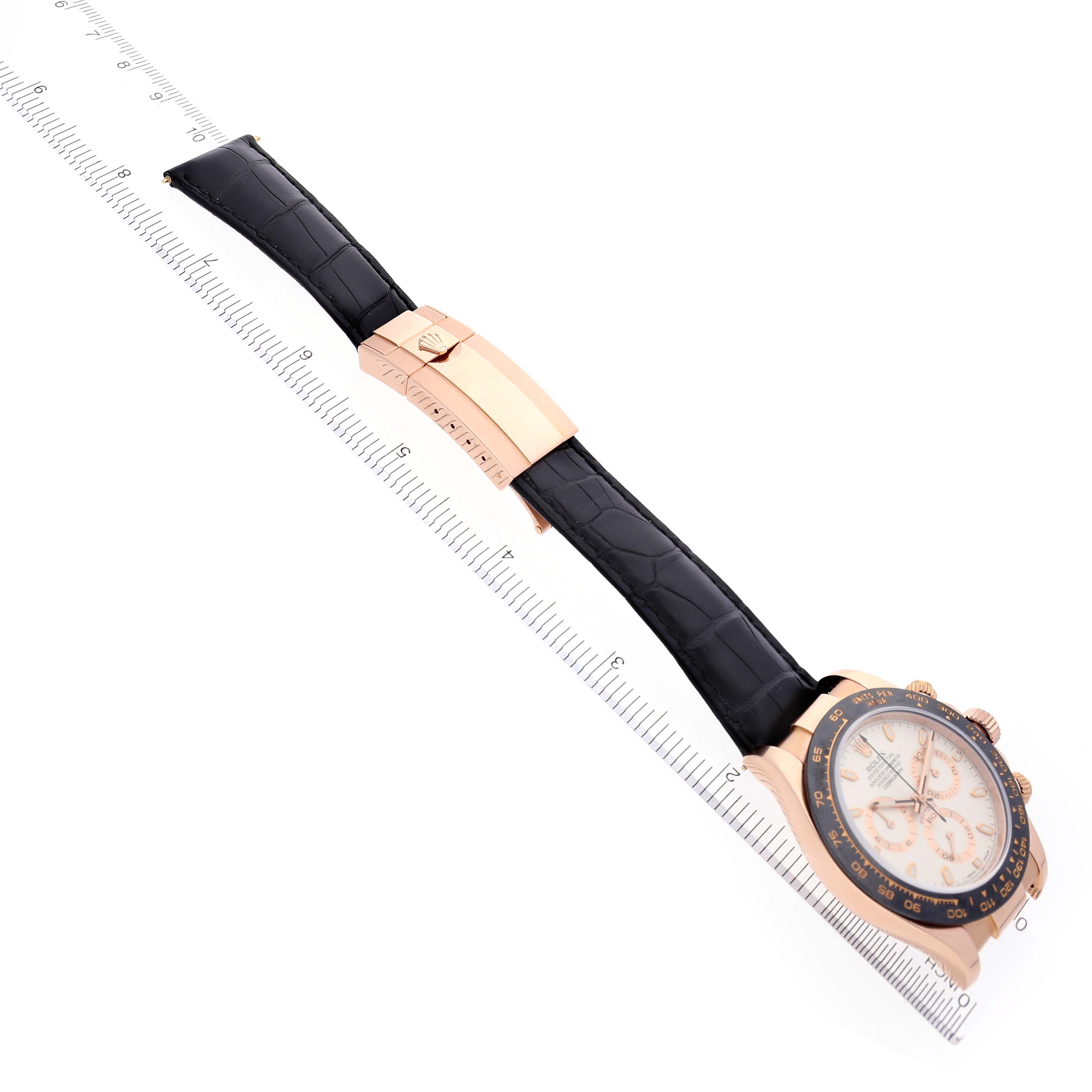 The image shows a Rolex Daytona 116515LN Men's Rose Gold White Dial 116515LN Men's Rose Gold White Dial watch from a top view, highlighting the face, bezel, strap, and clasp.