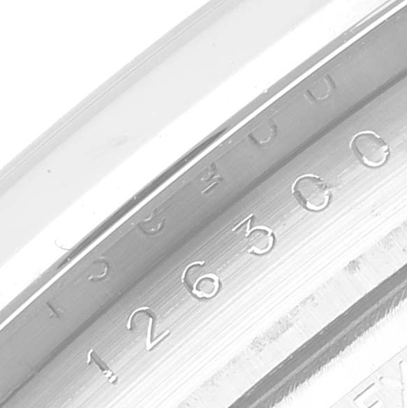 The image shows a close-up of the serial number engraving on the inner bezel of a Rolex Datejust 41 126300 Men's Stainless Steel White Dial 126300 Men's Stainless Steel White Dial watch.