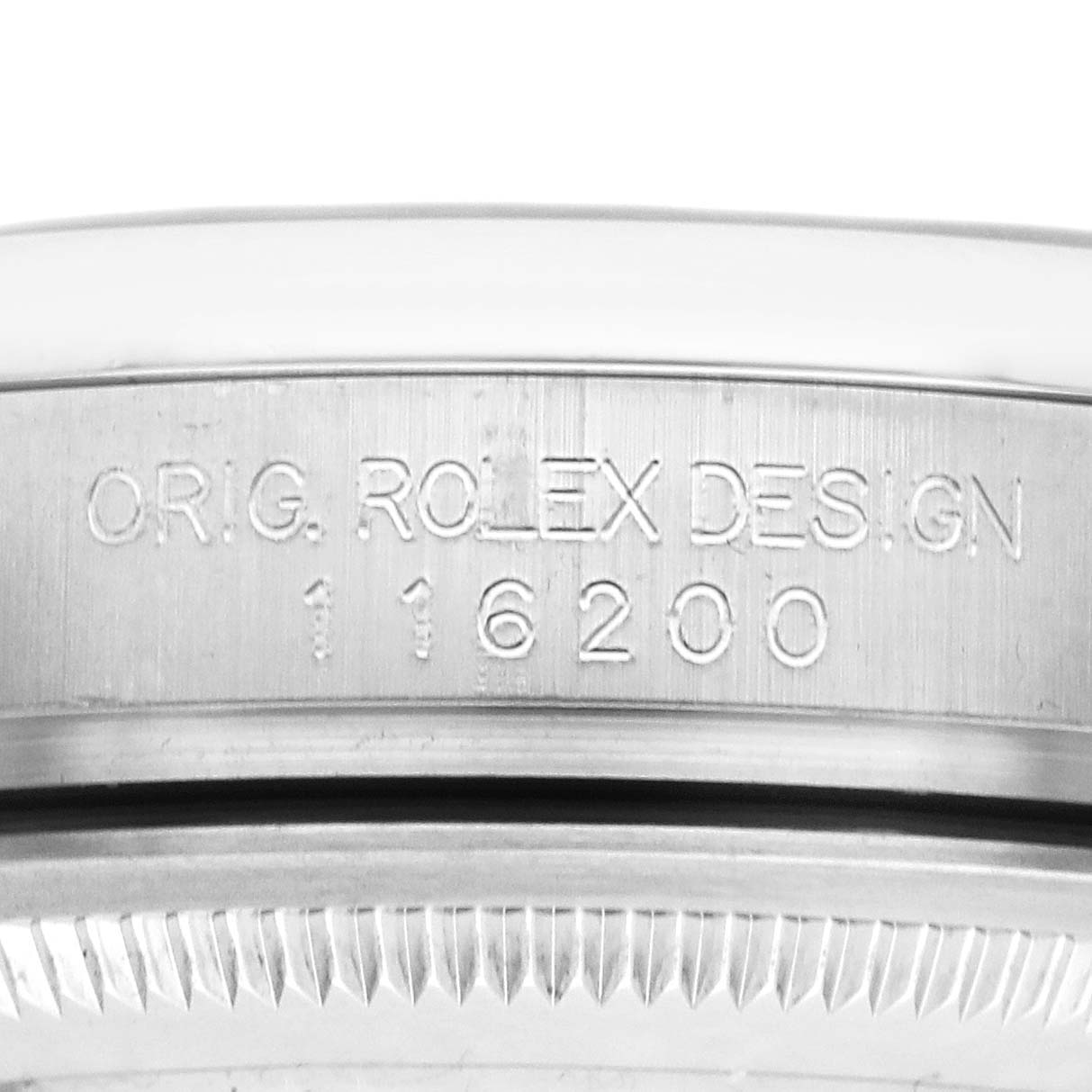 The image shows a close-up of the Rolex Datejust 116200 Men's Stainless Steel Black Dial model number and engraving on the side of the watch case.