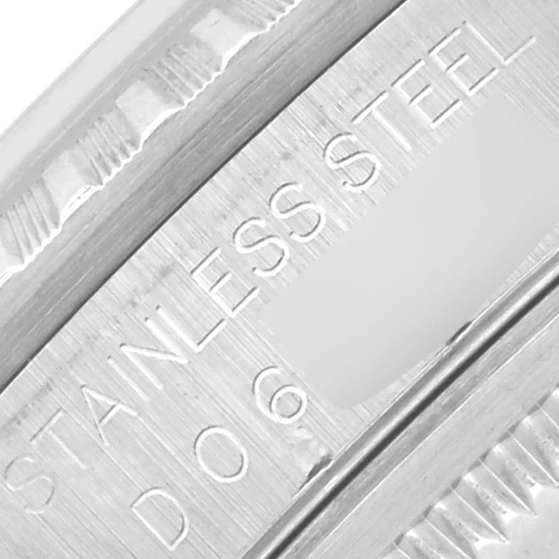 The image shows a close-up of the engravings on the case edge of a Rolex Datejust 16220 Men's Stainless Steel Silver Dial 16220 Men's Stainless Steel Silver Dial watch, highlighting "STAINLESS STEEL."