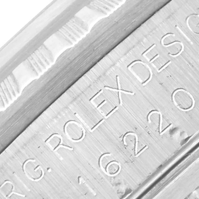 The image shows a close-up of the engraved edge of a Rolex Datejust 16220 Men's Stainless Steel Silver Dial 16220 Men's Stainless Steel Silver Dial watch case with model details.