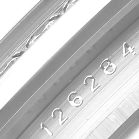 The image shows a close-up of the serial number on the side of a Rolex Datejust 126284 Men's Stainless Steel Pink Dial 126284 Men's Stainless Steel Pink Dial model watch case.