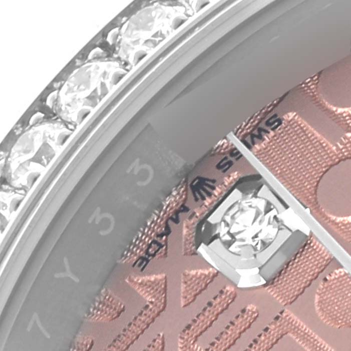 The image shows a close-up of the dial and bezel with diamonds on a Rolex Datejust 126284 Men's Stainless Steel Pink Dial 126284 Men's Stainless Steel Pink Dial.