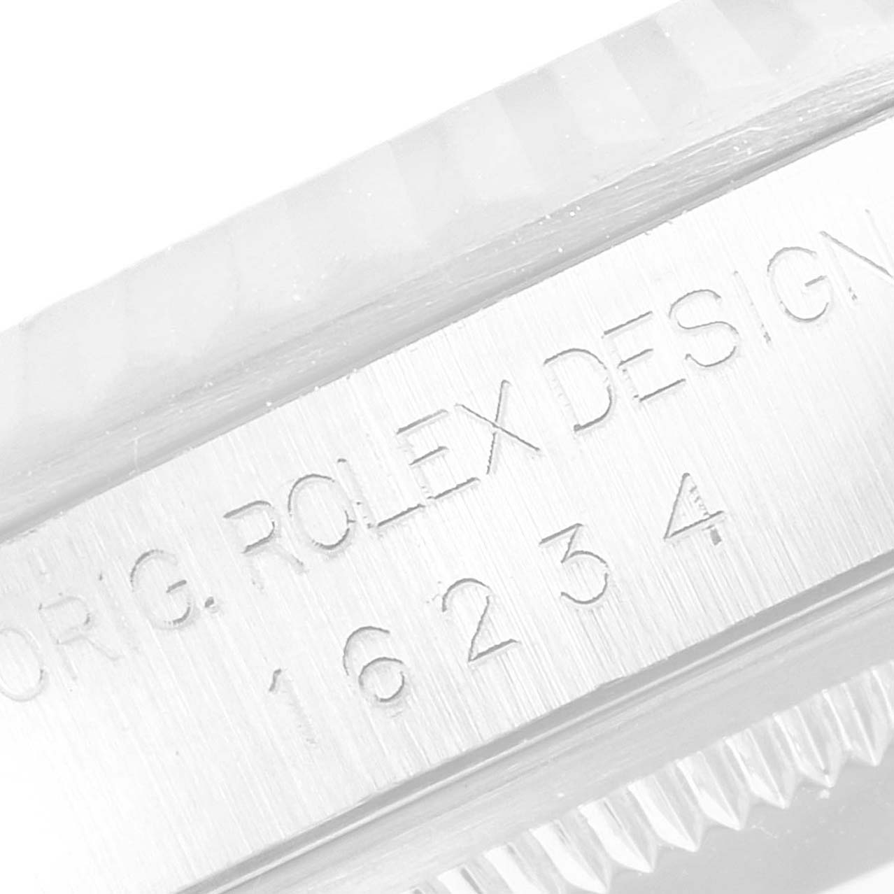 The image shows a close-up of the engraved serial number and text on the case side of a Rolex Datejust 16234 Men
s Stainless Steel Mother of Pearl Dial 16234 Men
s Stainless Steel Mother of Pearl Dial watch.