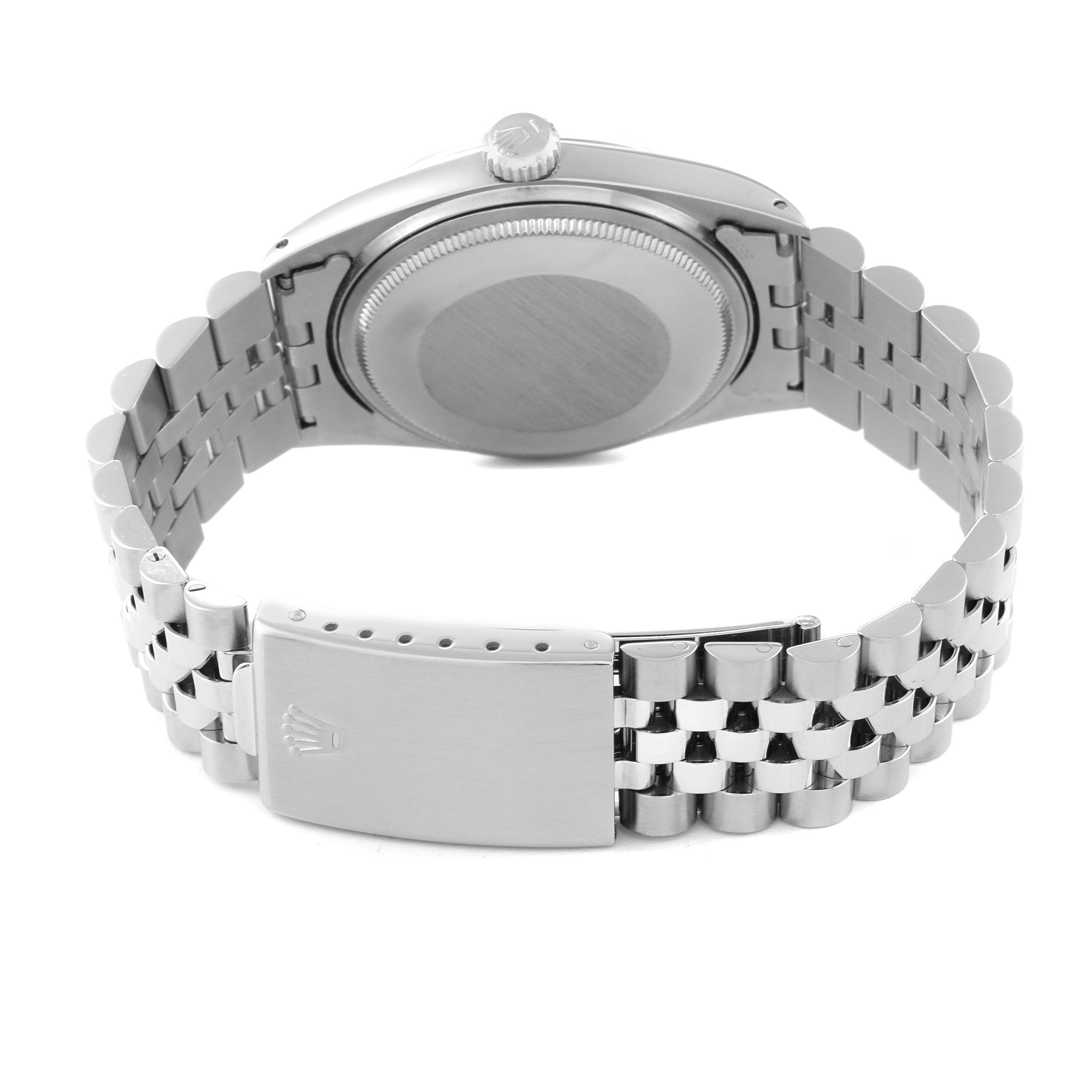 This image shows the back view of a Rolex Vintage Collection 1601 Men's Stainless Steel Silver Dial 1601 Men's Stainless Steel Silver Dial watch, featuring its case back, crown, and metal bracelet with clasp.