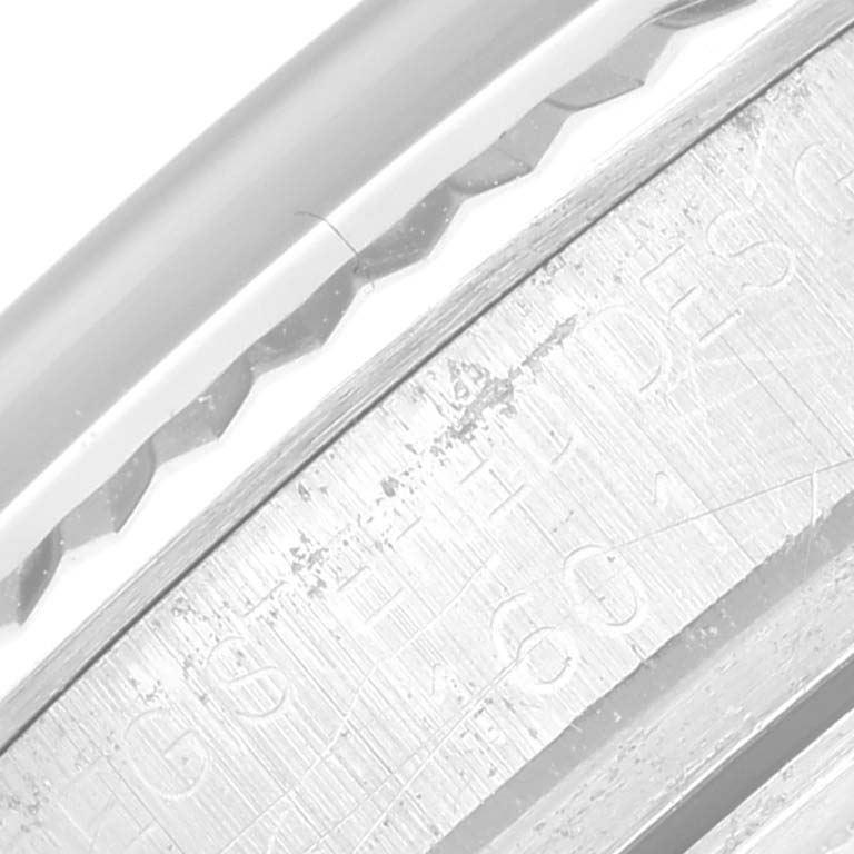 The image shows a close-up angle of the case side and bezel of a Rolex Vintage Collection 1601 Men's Stainless Steel Silver Dial 1601 Men's Stainless Steel Silver Dial model watch.