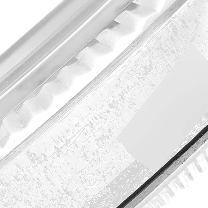 The image shows a close-up of the bezel and part of the crystal of a Vintage Collection watch by Rolex.