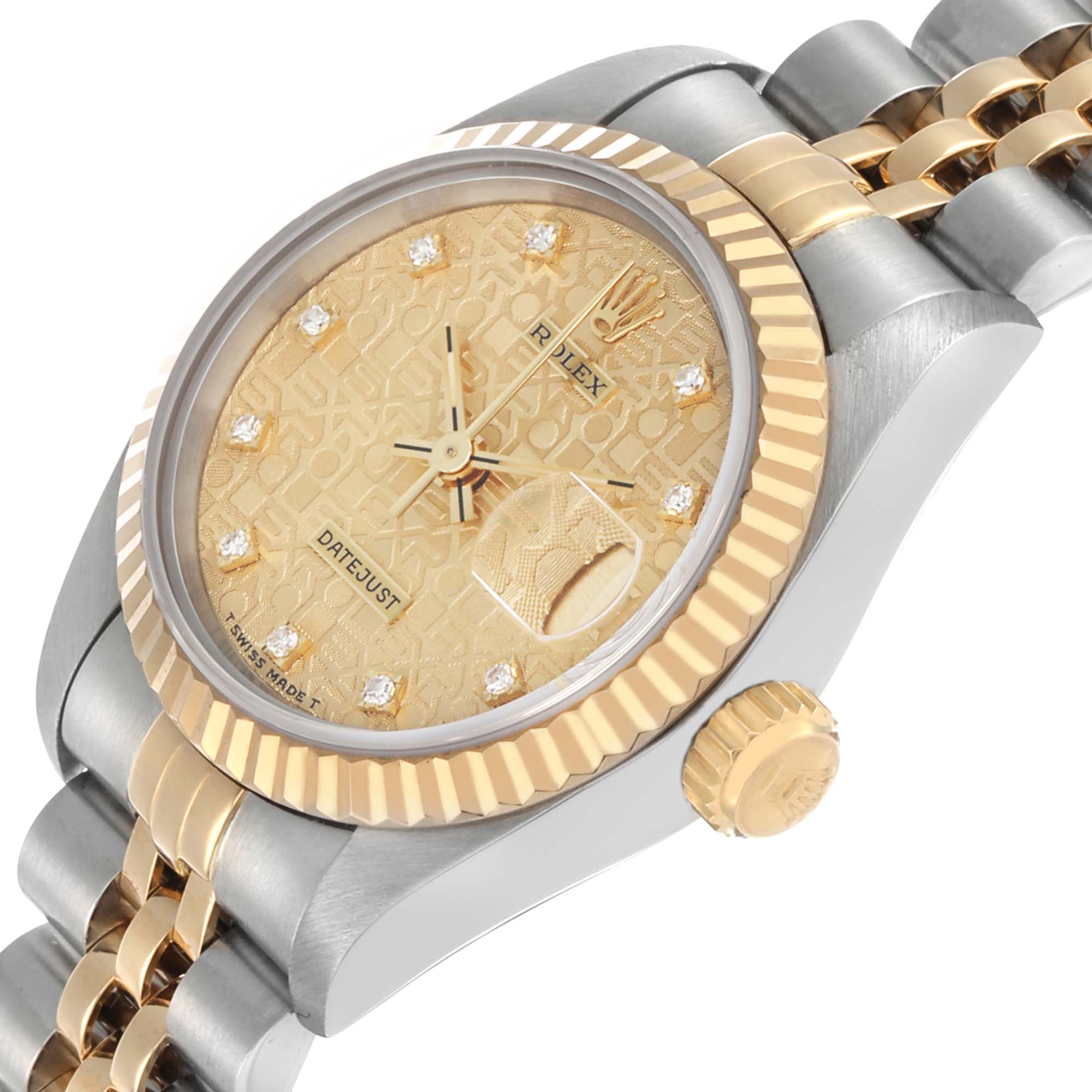 The Rolex Datejust 69173 Women's Steel and Gold (two tone) Champagne Dial watch is shown at an angle highlighting the crown, dial, bezel, and part of the bracelet.