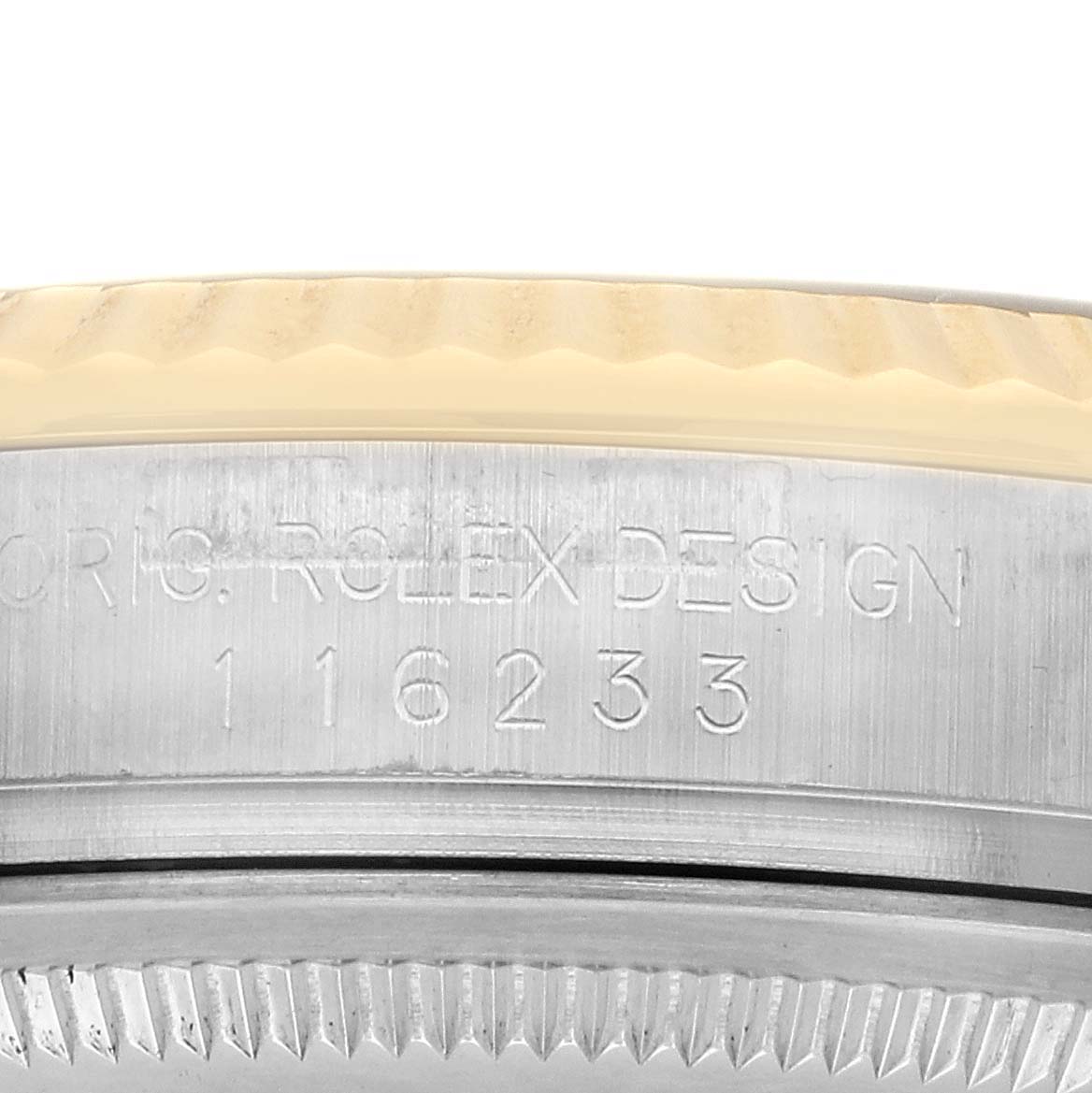 The image shows the side view of a Rolex Datejust 116233 Men's Steel and Gold (two tone) Black Dial, highlighting the engraved model number and bezel detail.