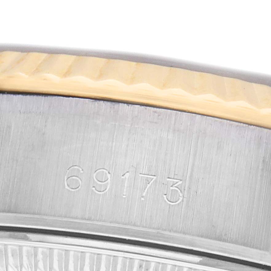 The image shows a close-up of the side of a Rolex Datejust 69173 Women's Steel and Gold (two tone) Black Dial watch, highlighting the model number and edge of the bezel.