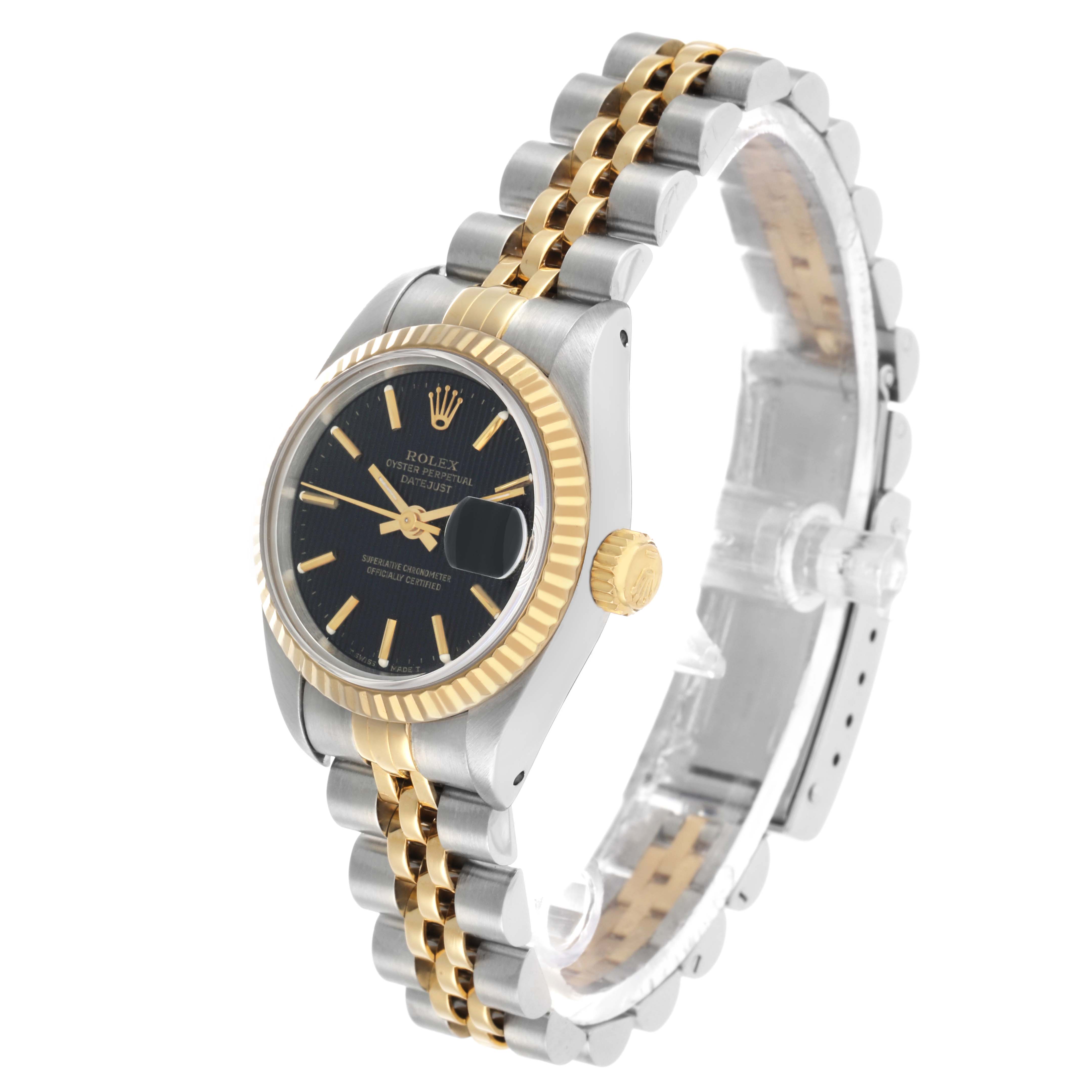 The Rolex Datejust 69173 Women's Steel and Gold (two tone) Black Dial watch is shown at an angle displaying the dial, fluted bezel, and two-tone Jubilee bracelet.