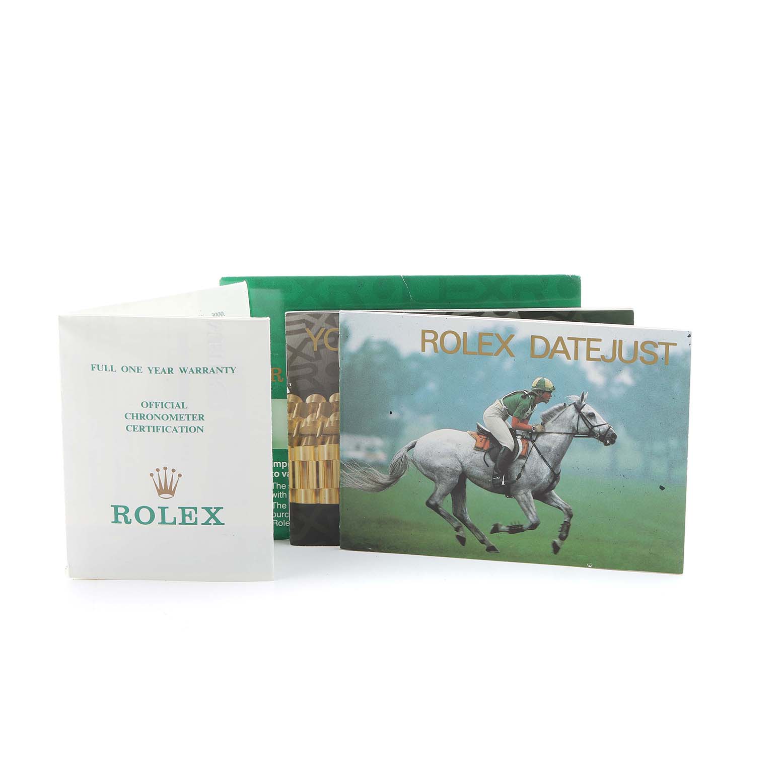 The image shows booklets and a warranty card for the Rolex Datejust 69173 Women's Steel and Gold (two tone) Black Dial, including official chronometer certification documents.