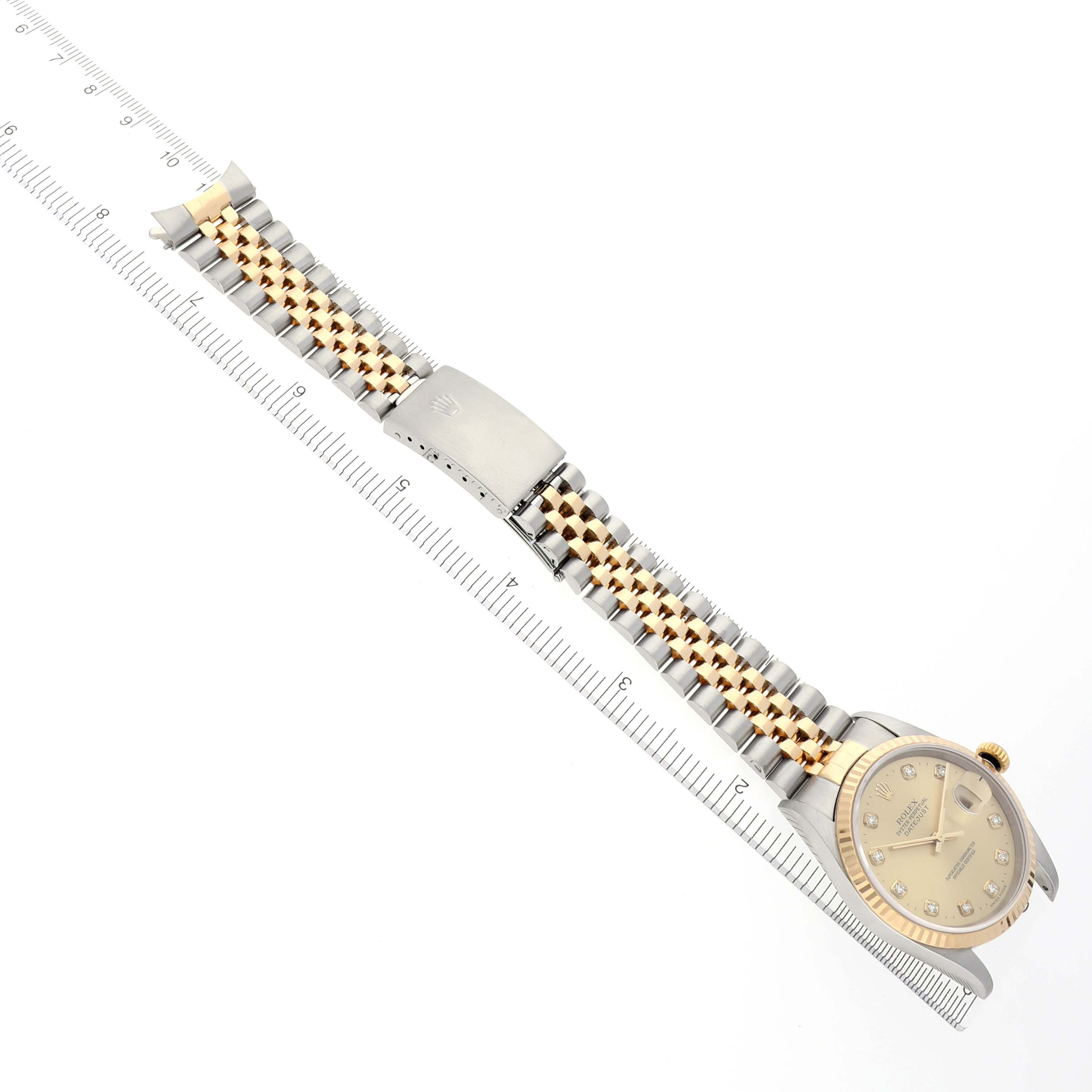 The Rolex Datejust 16233 Men's Steel and Gold (two tone) Champagne Dial 16233 Men's Steel and Gold (two tone) Champagne Dial watch is shown from a top view, highlighting the bracelet, clasp, and dial.