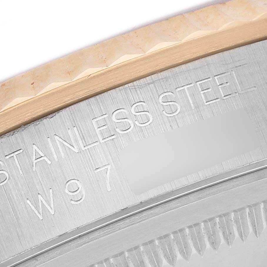 The image shows a close-up of the side engravings on the bezel of a Rolex Datejust 16233 Men's Steel and Gold (two tone) White Dial 16233 Men's Steel and Gold (two tone) White Dial watch.