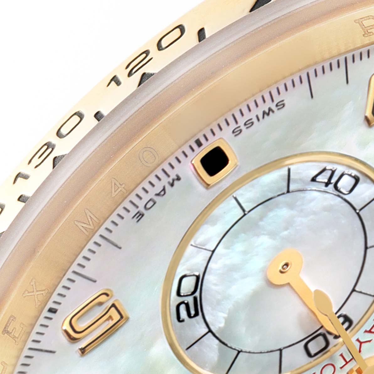 The image shows a close-up of the dial, bezel, and a sub-dial of a Rolex Daytona 116518 Men's Yellow Gold Mother of Pearl Dial 116518 Men's Yellow Gold Mother of Pearl Dial watch, including some minute markers and engraved numbers.