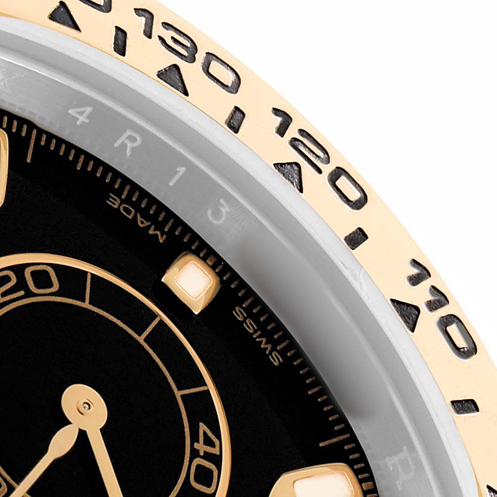 The image shows a close-up view of the Rolex Daytona 116503 Men's Steel and Gold (two tone) Black Dial bezel and part of the dial, highlighting the tachymetric scale.