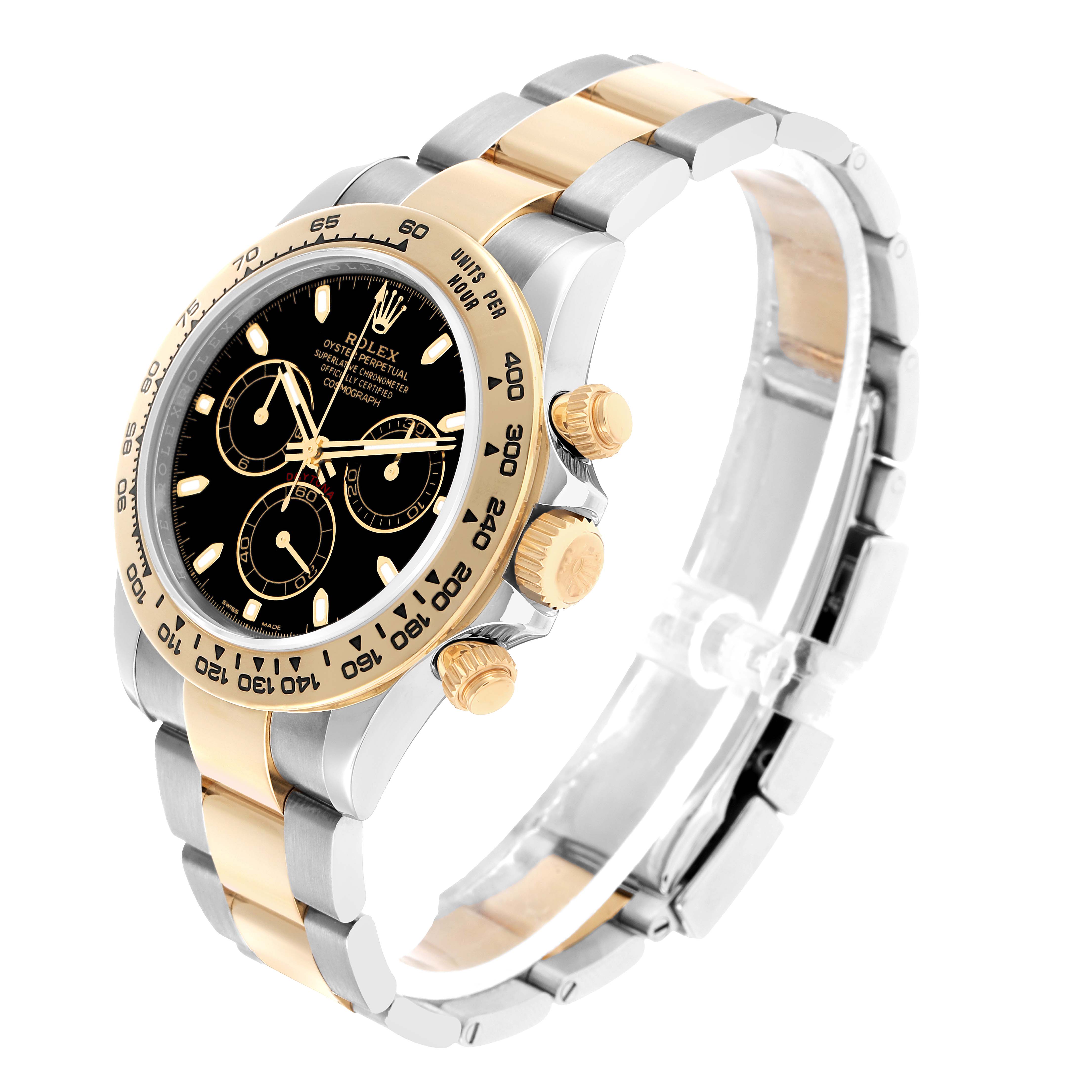 The Rolex Daytona 116503 Men's Steel and Gold (two tone) Black Dial watch is shown at an angle, revealing the face, bezel, crown, pushers, and bracelet.