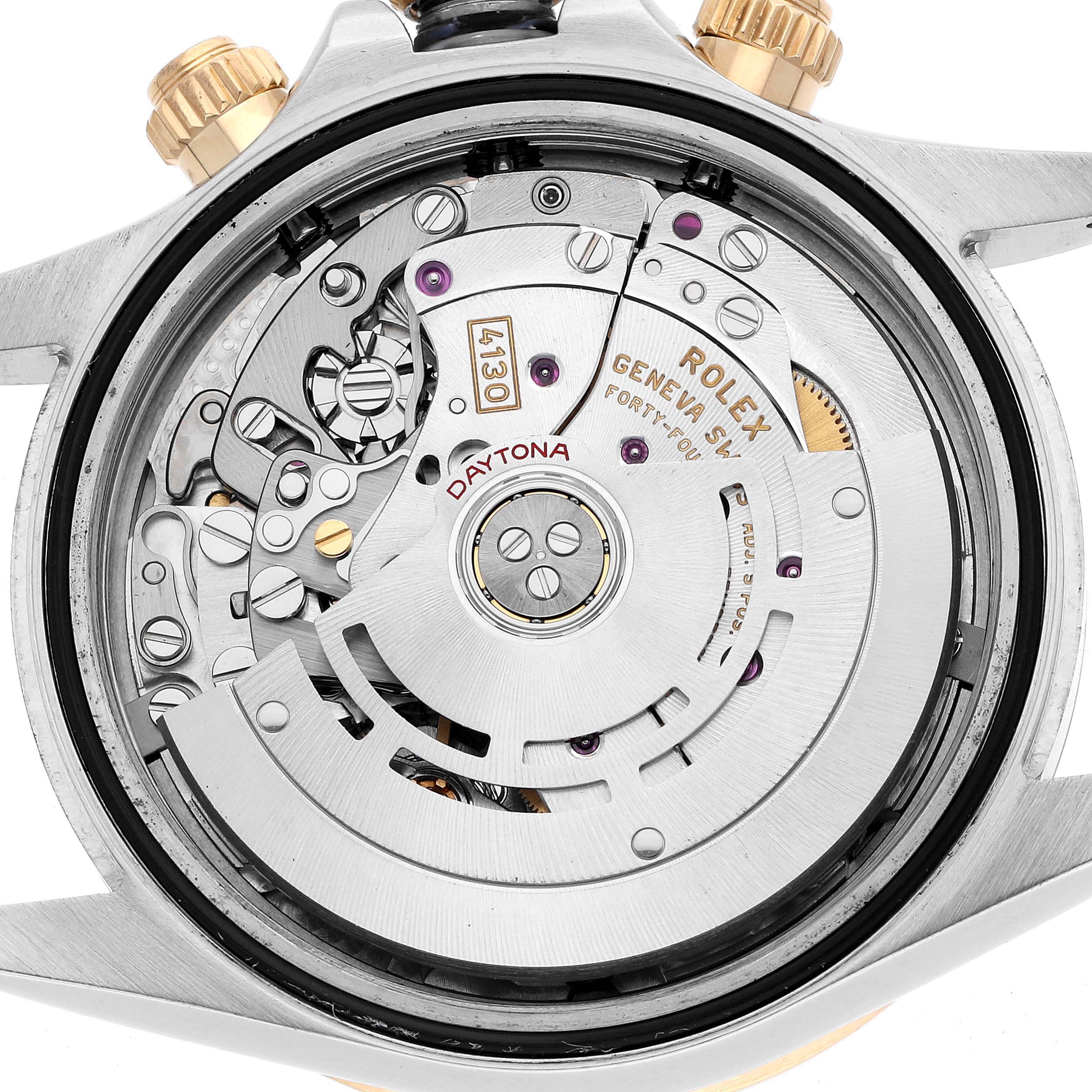 The image shows the movement of a Rolex Daytona 116503 Men's Steel and Gold (two tone) Black Dial, viewed from the back, highlighting gears and the rotor.