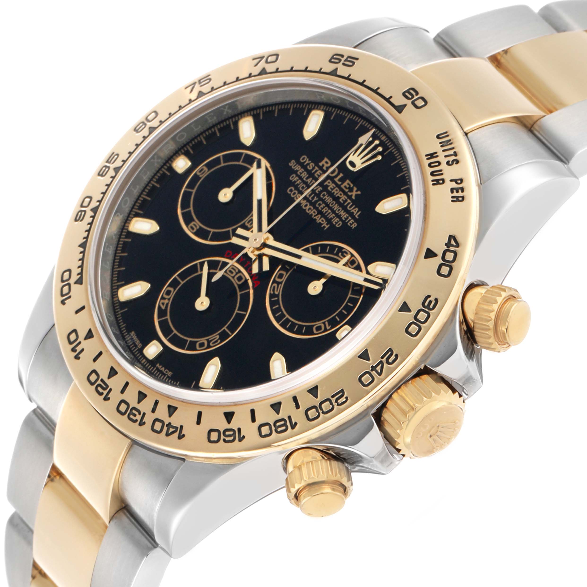The Rolex Daytona 116503 Men's Steel and Gold (two tone) Black Dial watch is shown at an angled side view, highlighting the bezel, face, crown, and part of the bracelet.