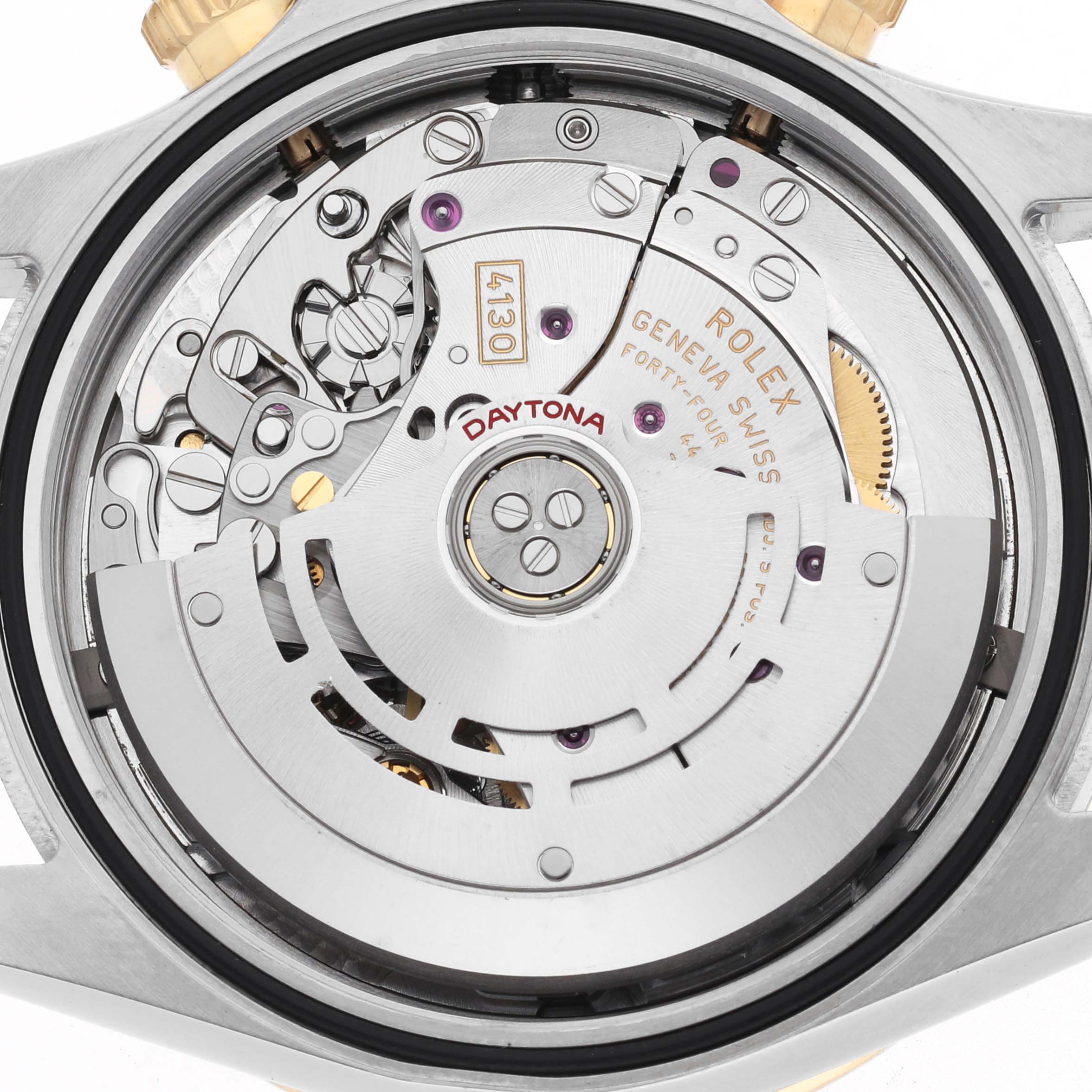 The image shows a close-up view of the Rolex Daytona 116503 Men's Steel and Gold (two tone) Black Dial model's movement, highlighting the intricate gears and components.