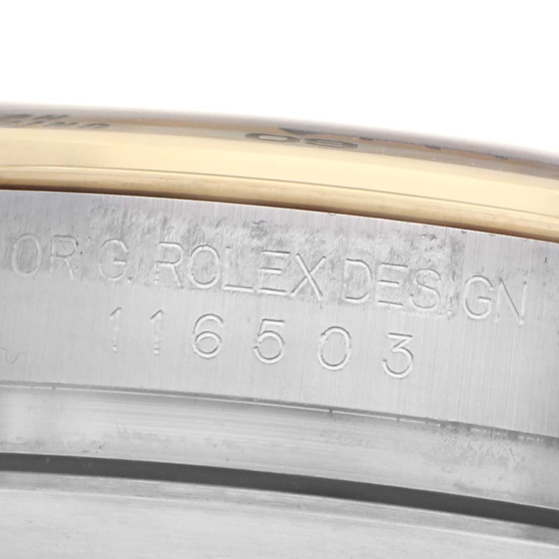 The image shows a close-up of the side of a Rolex Daytona 116503 Men's Steel and Gold (two tone) Champagne Dial watch, highlighting the engraved model number and "Rolex Design" text.