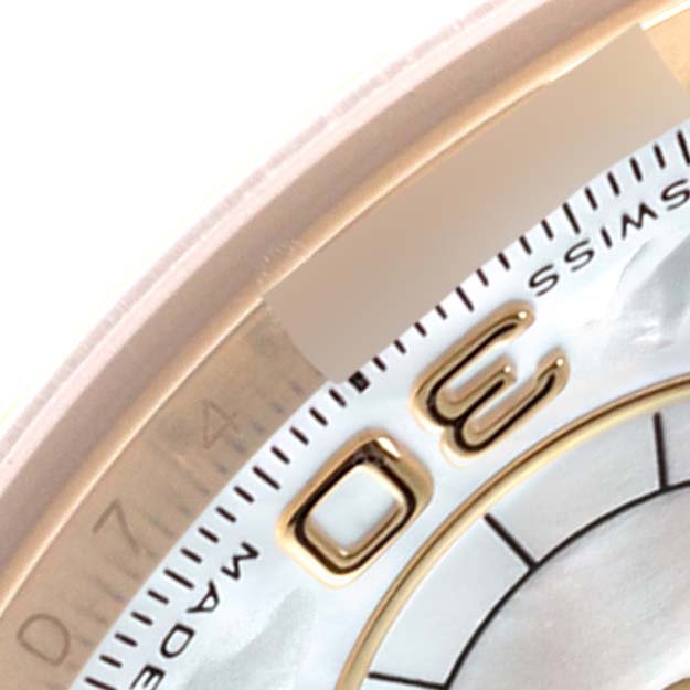 The image shows a close-up of the dial and bezel of a Rolex Daytona 116518 Men's Yellow Gold Mother of Pearl Dial 116518 Men's Yellow Gold Mother of Pearl Dial, featuring hour markers and part of the "SWISS MADE" text.