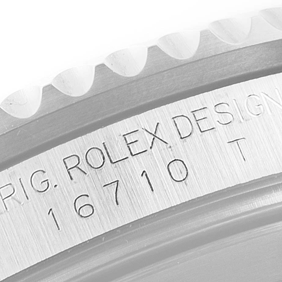 This image shows a close-up of the case side of a Rolex GMT-Master 16710 Men
s Stainless Steel Black Dial 16710 Men
s Stainless Steel Black Dial model 16710, focusing on its engraved design details.