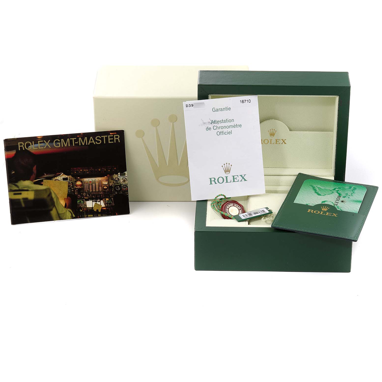 The image shows the packaging, booklets, warranty card, and tags for a Rolex GMT-Master 16710 Men
s Stainless Steel Black Dial 16710 Men
s Stainless Steel Black Dial watch.